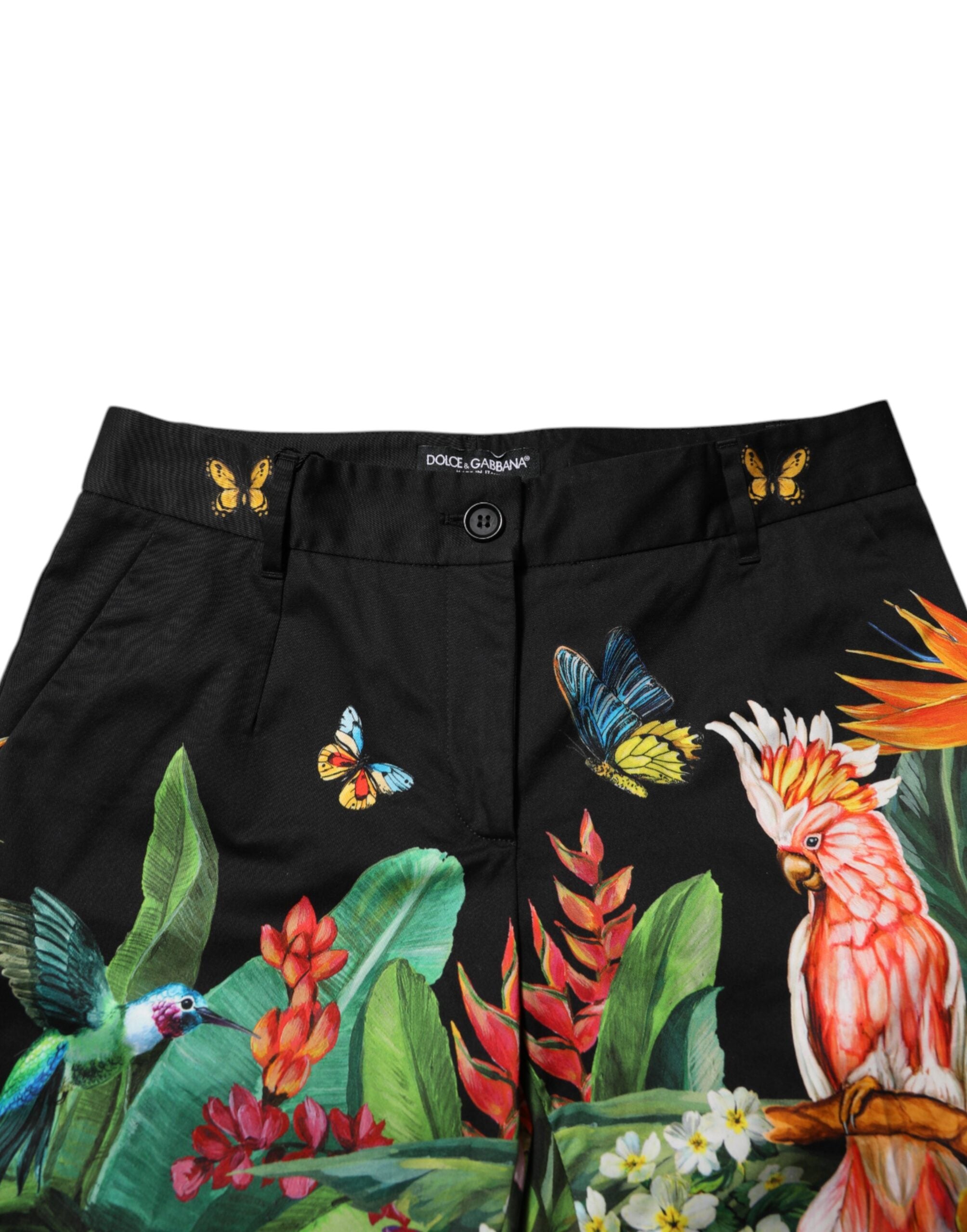 Experience the exquisite craftsmanship of Dolce & Gabbana's Black Cotton Tropical Mid Waist Pants, where luxury meets elegance in a vibrant tropical design, perfect for any sophisticated occasion.