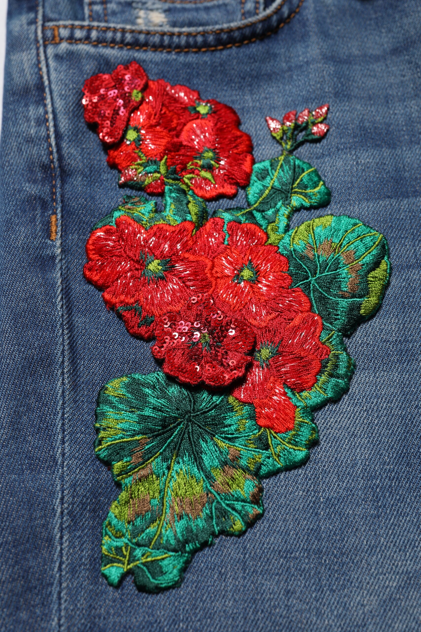 Indulge in the opulent allure of Dolce & Gabbana's Blue Cotton Low Waist Skinny Denim Jeans, where exquisite floral embroidery meets luxurious craftsmanship for a statement of refined elegance.