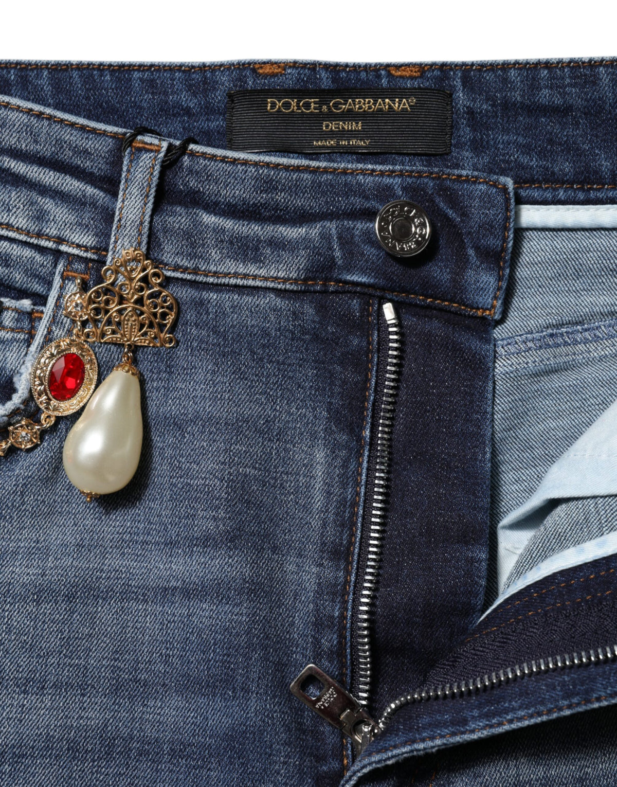 Elevate your wardrobe with Dolce & Gabbana's Blue Rhinestone Embellished Denim Jeans, where exquisite craftsmanship meets luxurious style for the discerning individual.