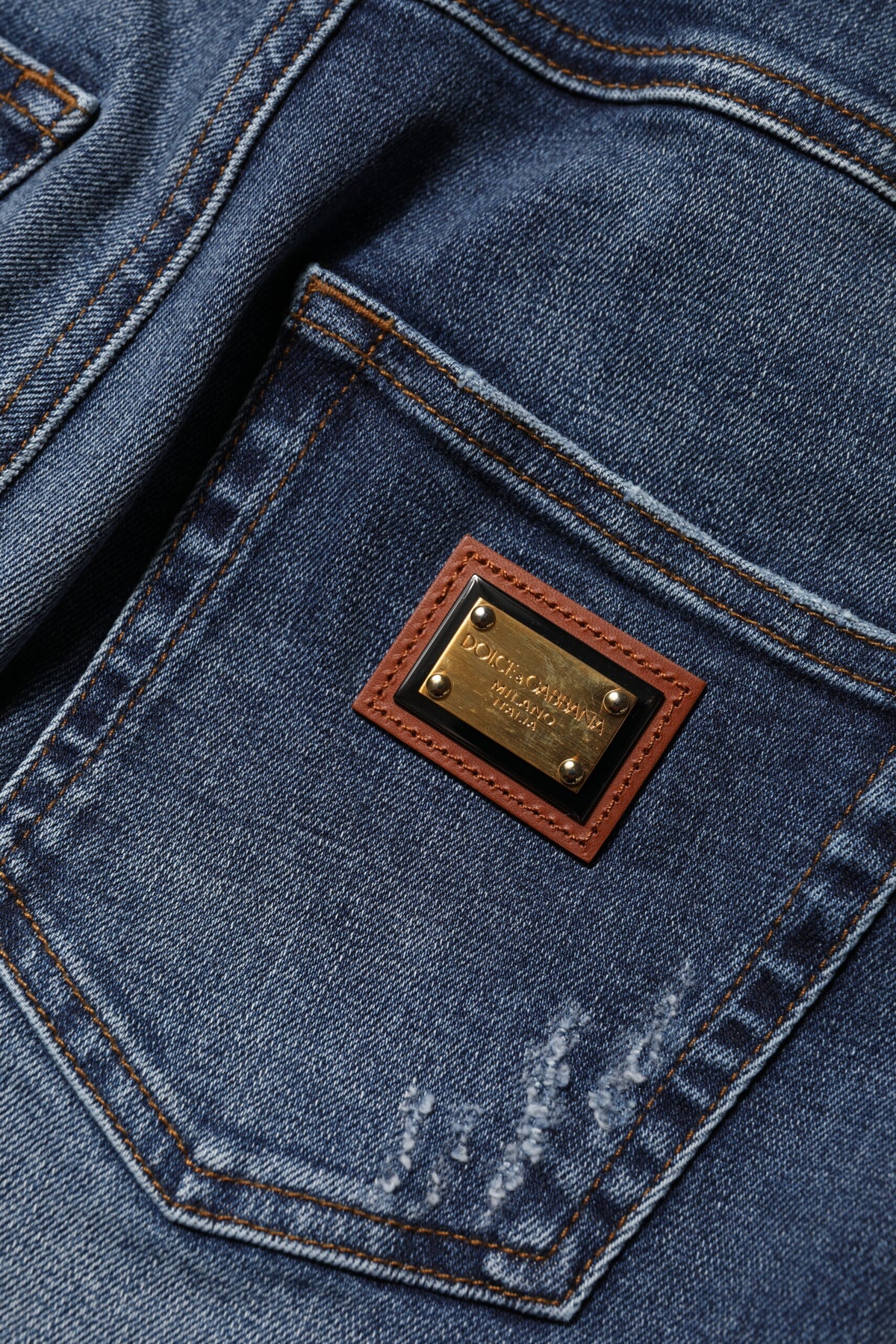 Elevate your style with Dolce & Gabbana's Blue Rhinestone Embellished Denim Jeans, where exquisite craftsmanship meets luxurious comfort, perfect for any sophisticated occasion.