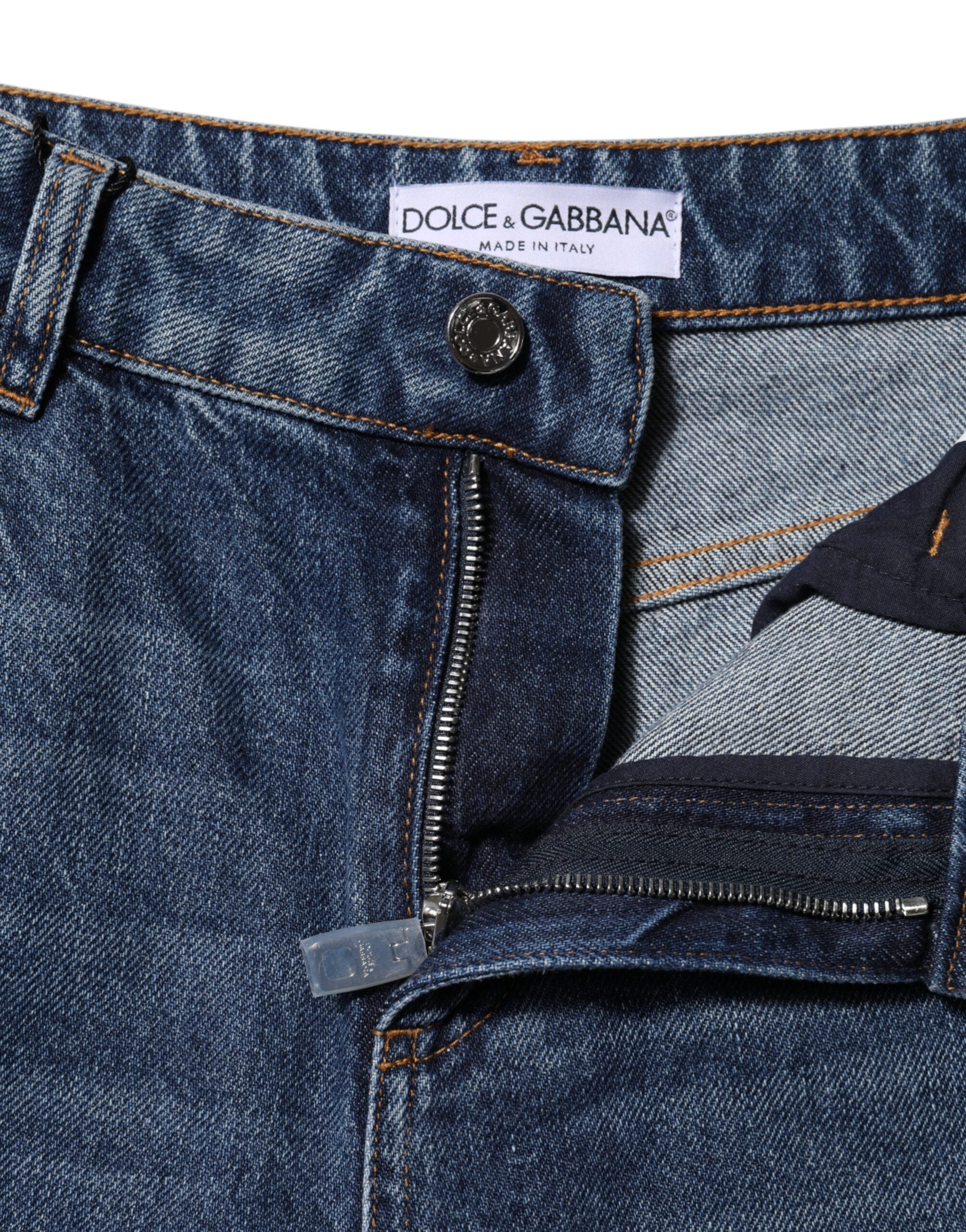 Experience the allure of Dolce & Gabbana's Blue Cotton Wide Leg Tattered Denim Jeans, crafted from luxurious cotton for unmatched elegance and comfort, embodying Italian sophistication.