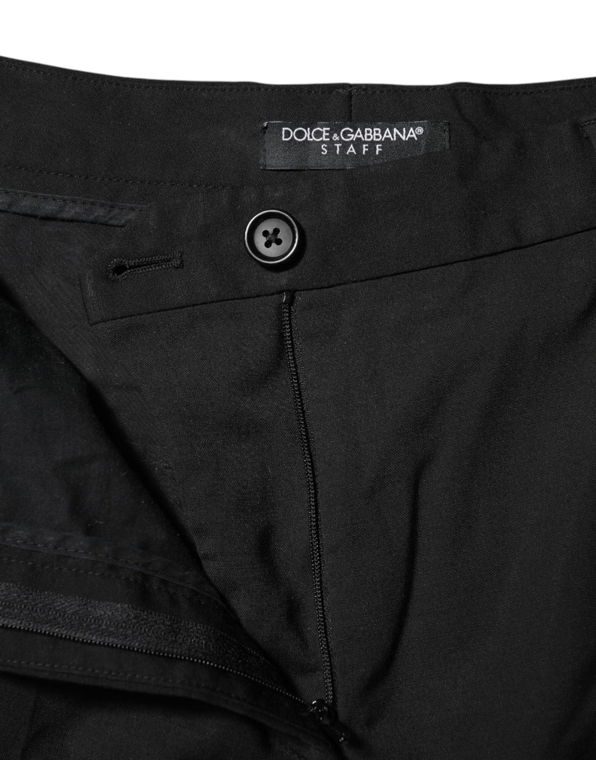 Indulge in the exquisite craftsmanship of Dolce & Gabbana's Black STAFF High Waist Tapered Pants, a luxurious blend of virgin wool and polyester, redefining elegance.