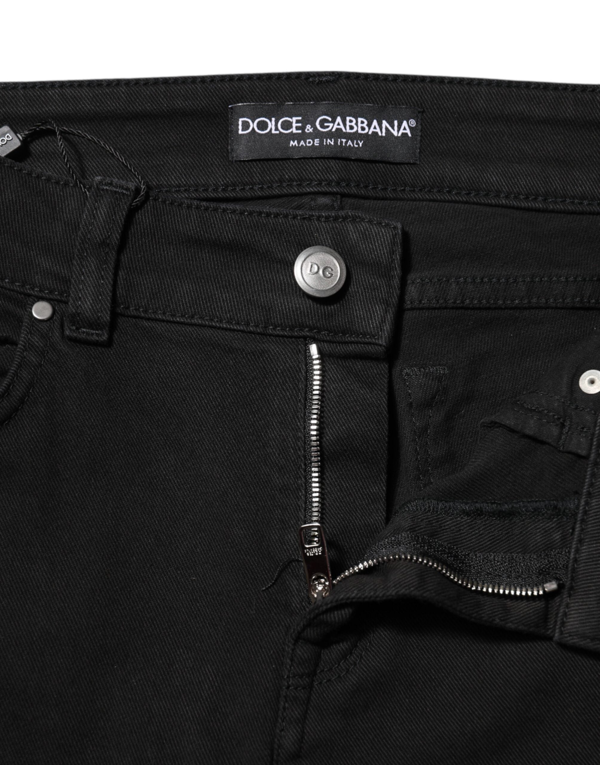 Elevate your wardrobe with Dolce & Gabbana's Black Cotton Logo Skinny Mid Waist Denim Jeans, where exquisite Italian craftsmanship meets timeless elegance for the discerning fashion lover.