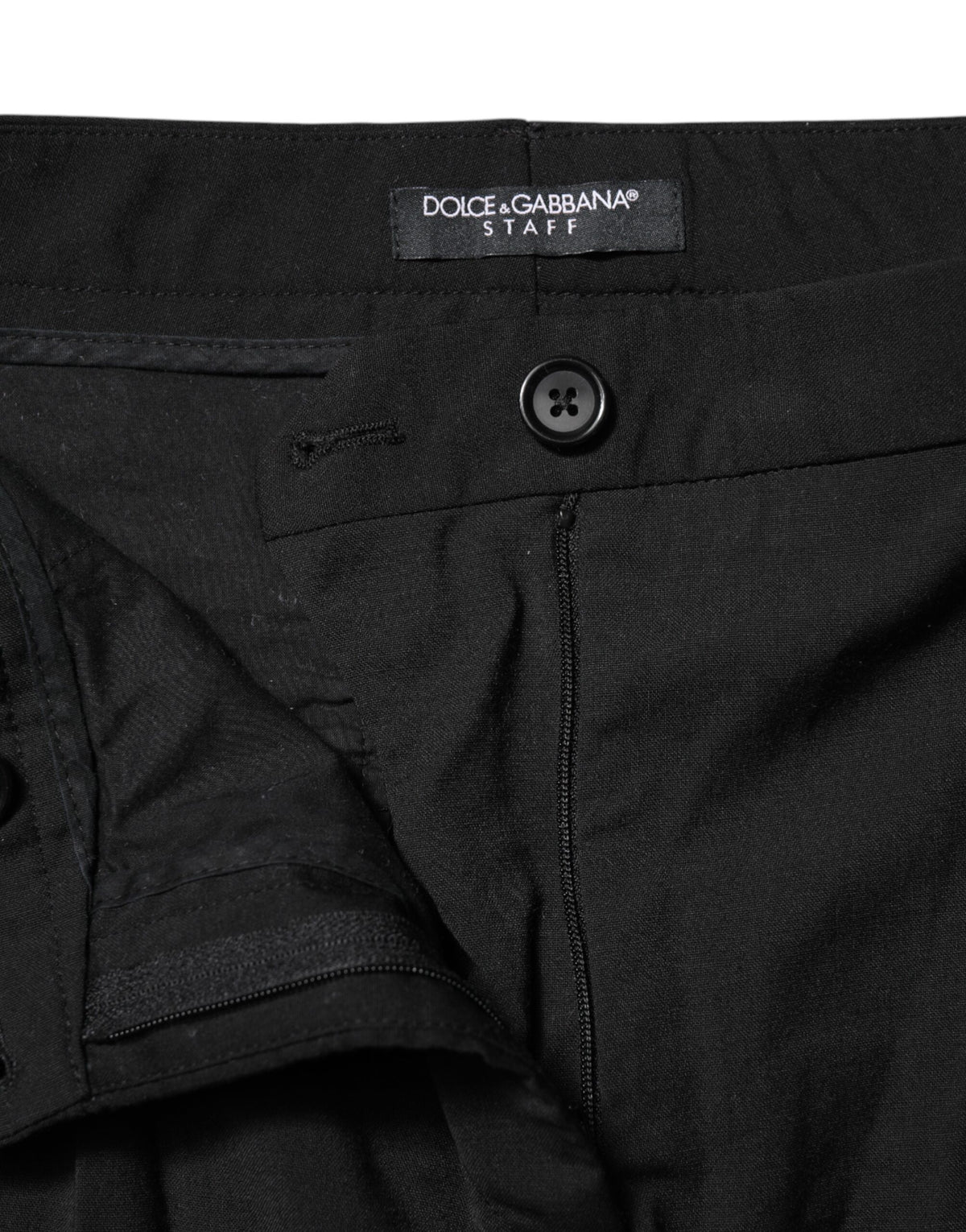 Elevate your wardrobe with Dolce & Gabbana's Black STAFF Mid Waist Tapered Pants, expertly crafted in Italy from luxurious materials for timeless elegance and refined sophistication.