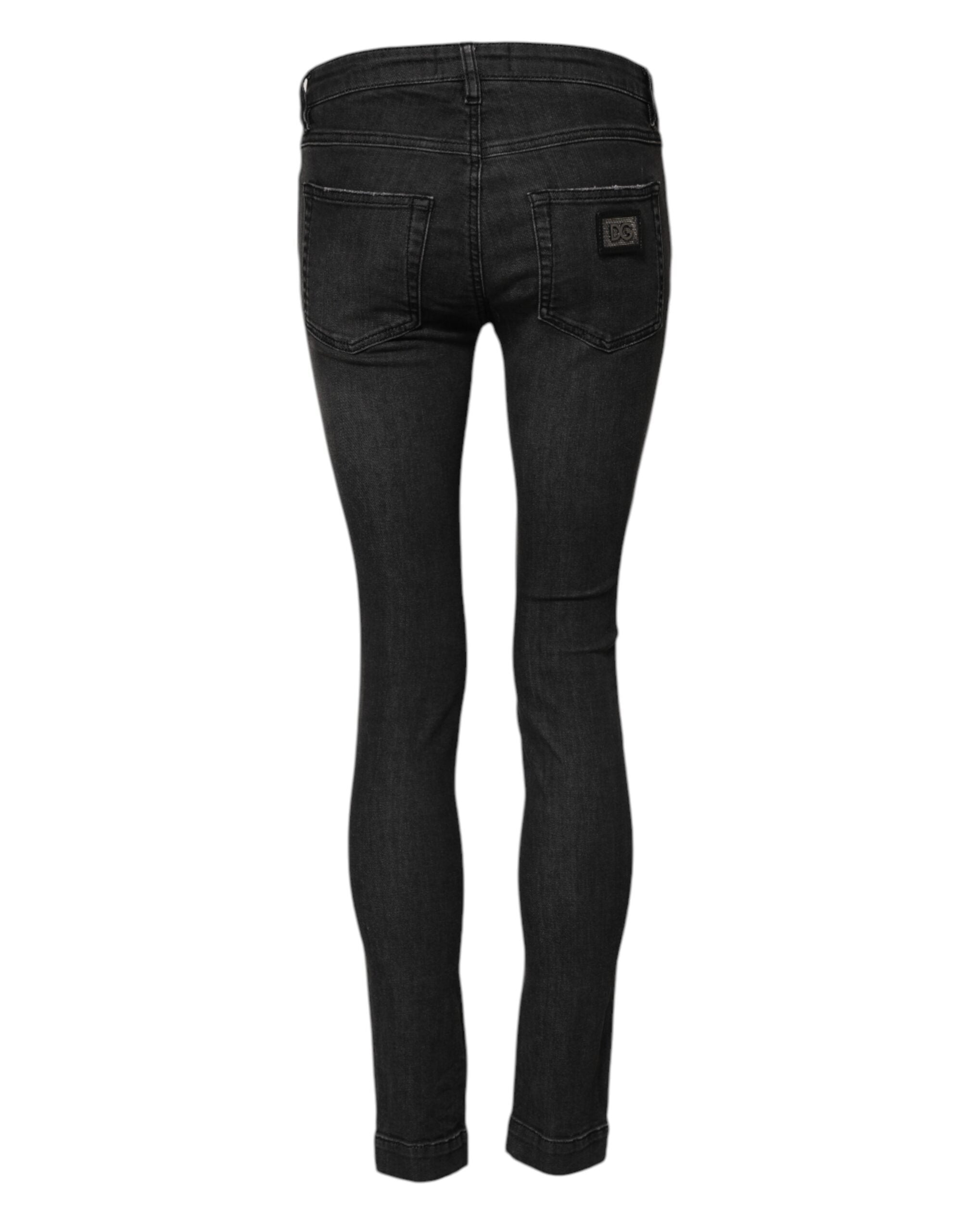 Indulge in the exquisite allure of Dolce & Gabbana's Black Cotton Low Waist Skinny Denim Jeans, where luxurious craftsmanship meets modern sophistication for the discerning individual.