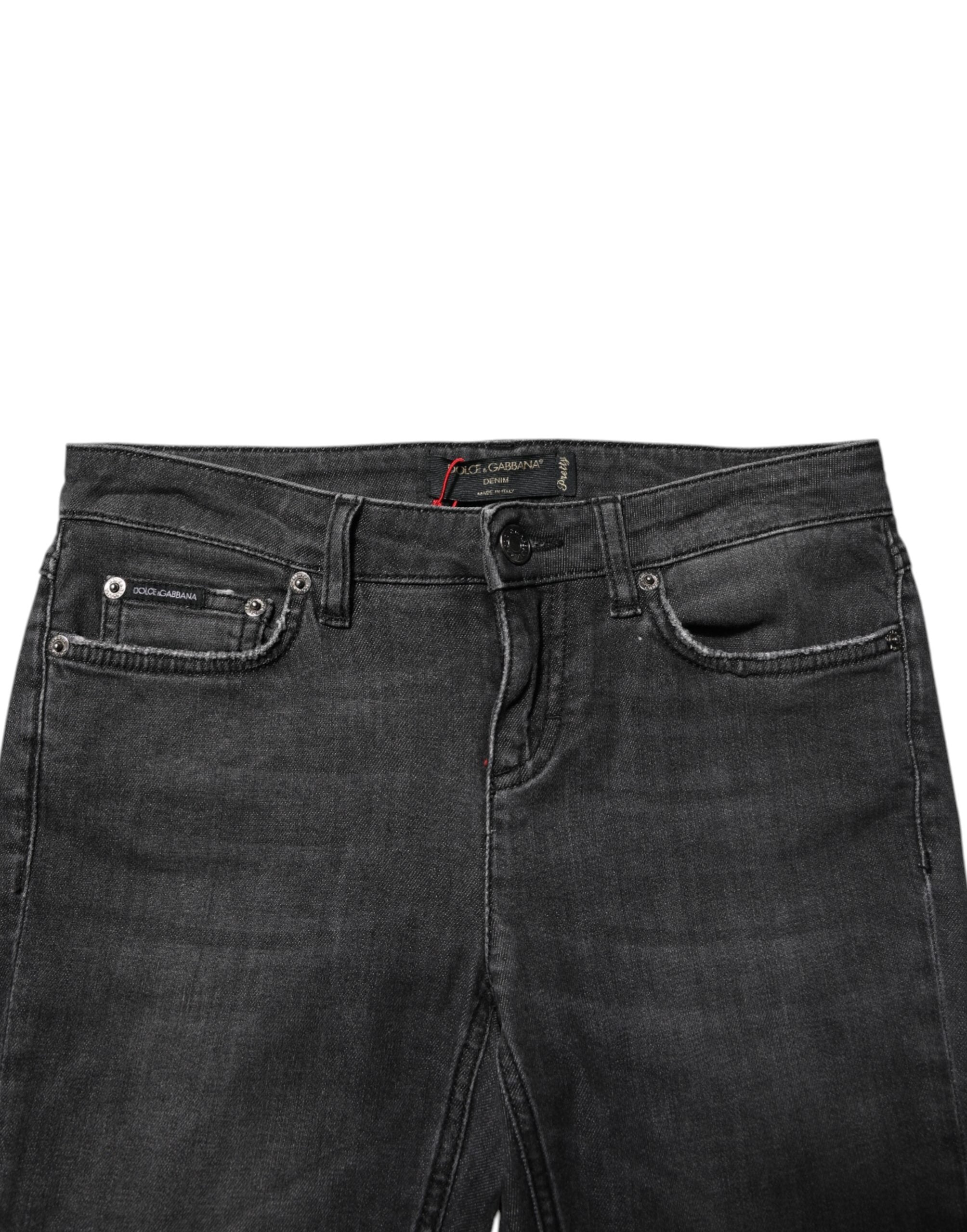 Indulge in the exquisite allure of Dolce & Gabbana's Black Cotton Low Waist Skinny Denim Jeans, where luxurious craftsmanship meets modern elegance for the discerning individual.