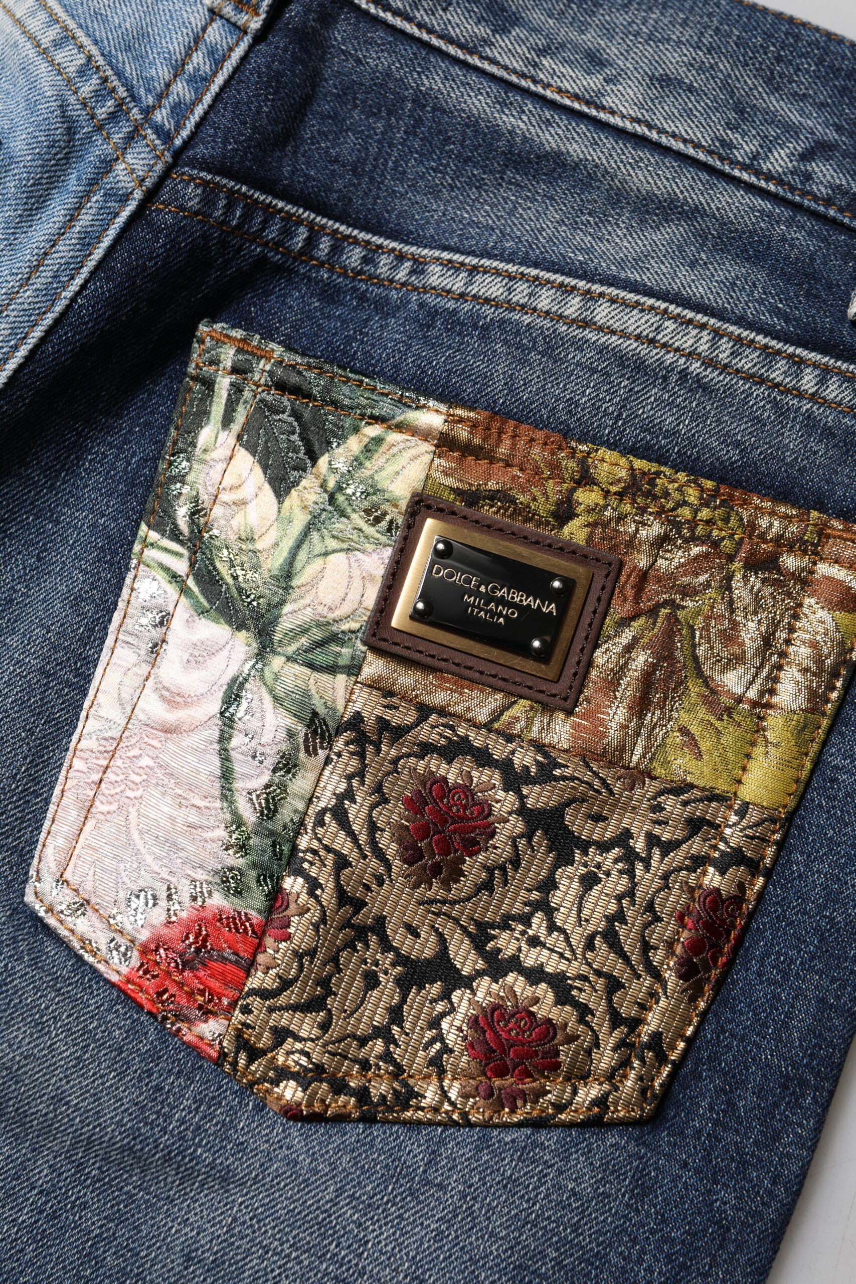 Discover the exquisite Dolce & Gabbana Multicolor Patchwork Tapered Denim Jeans, crafted in Italy from a luxurious blend of silk and fibers, embodying artistry and elegance for the discerning individual.