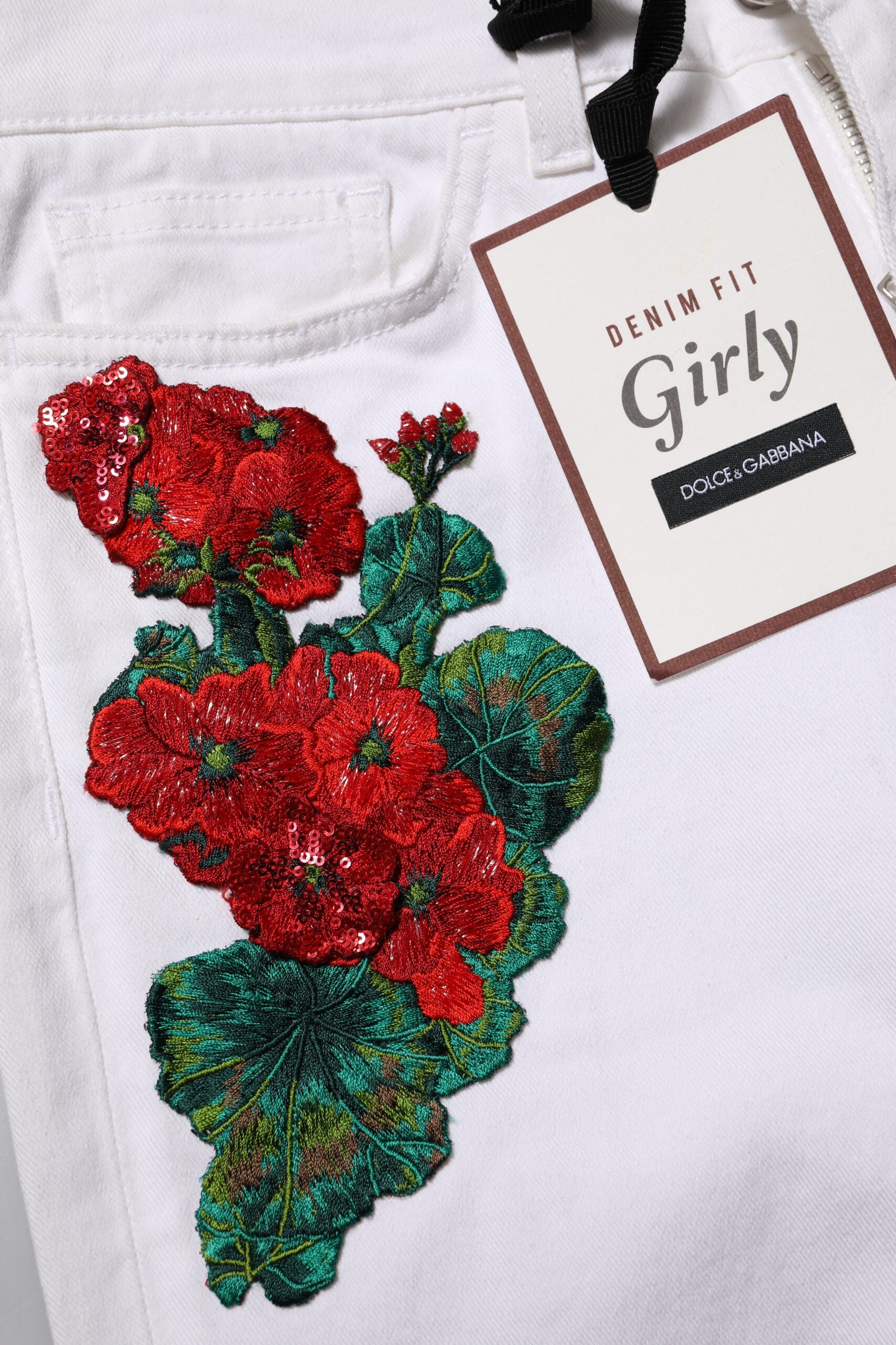 Elevate your style with Dolce & Gabbana's White Floral Embroidery GIRLY Denim Jeans, a masterpiece of Italian craftsmanship that embodies luxury and timeless elegance.