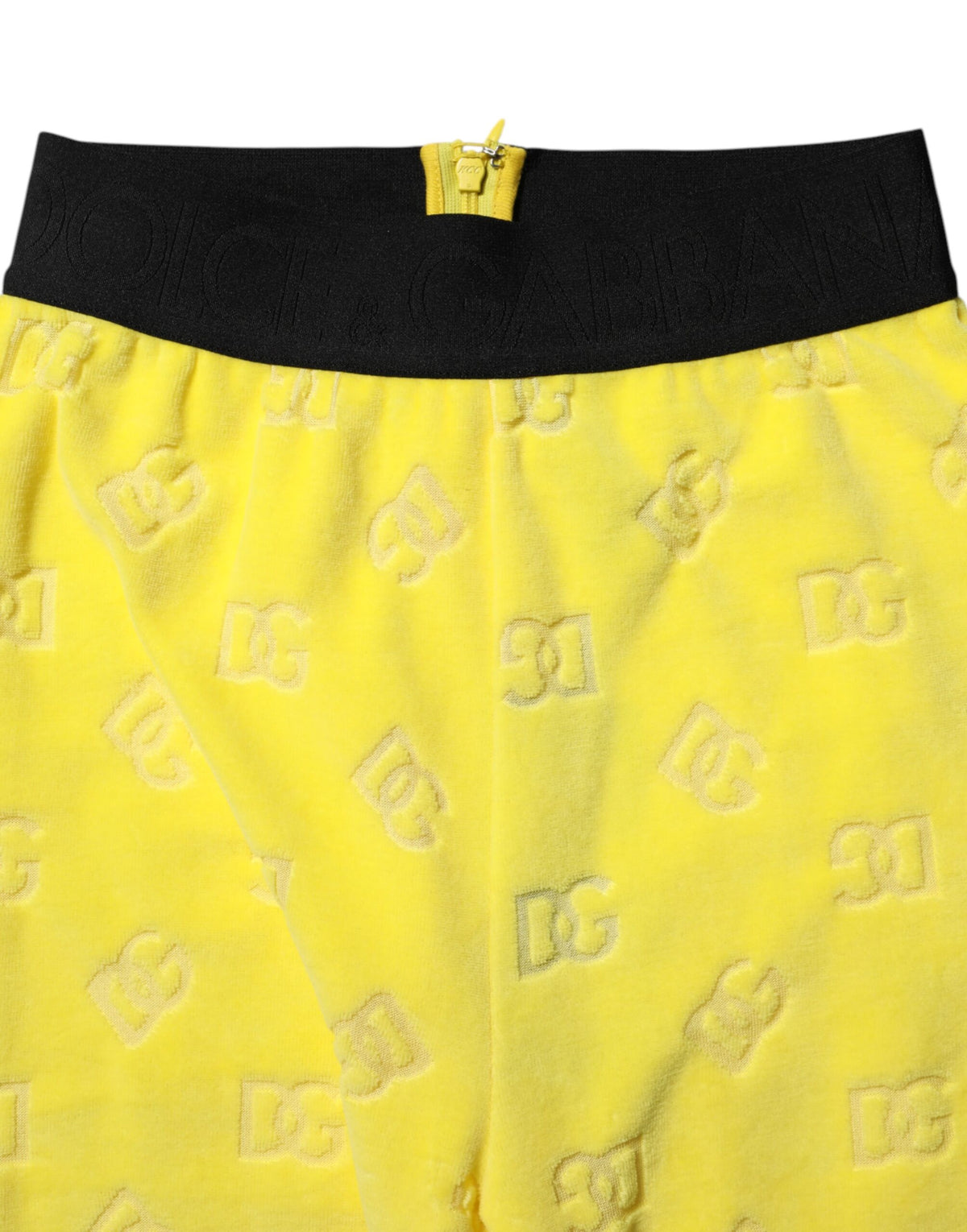 Experience the allure of Dolce & Gabbana's Yellow Logo Slim Fit Leggings Pants, crafted in Italy from 100% cotton, embodying luxury and chic elegance for the discerning individual.