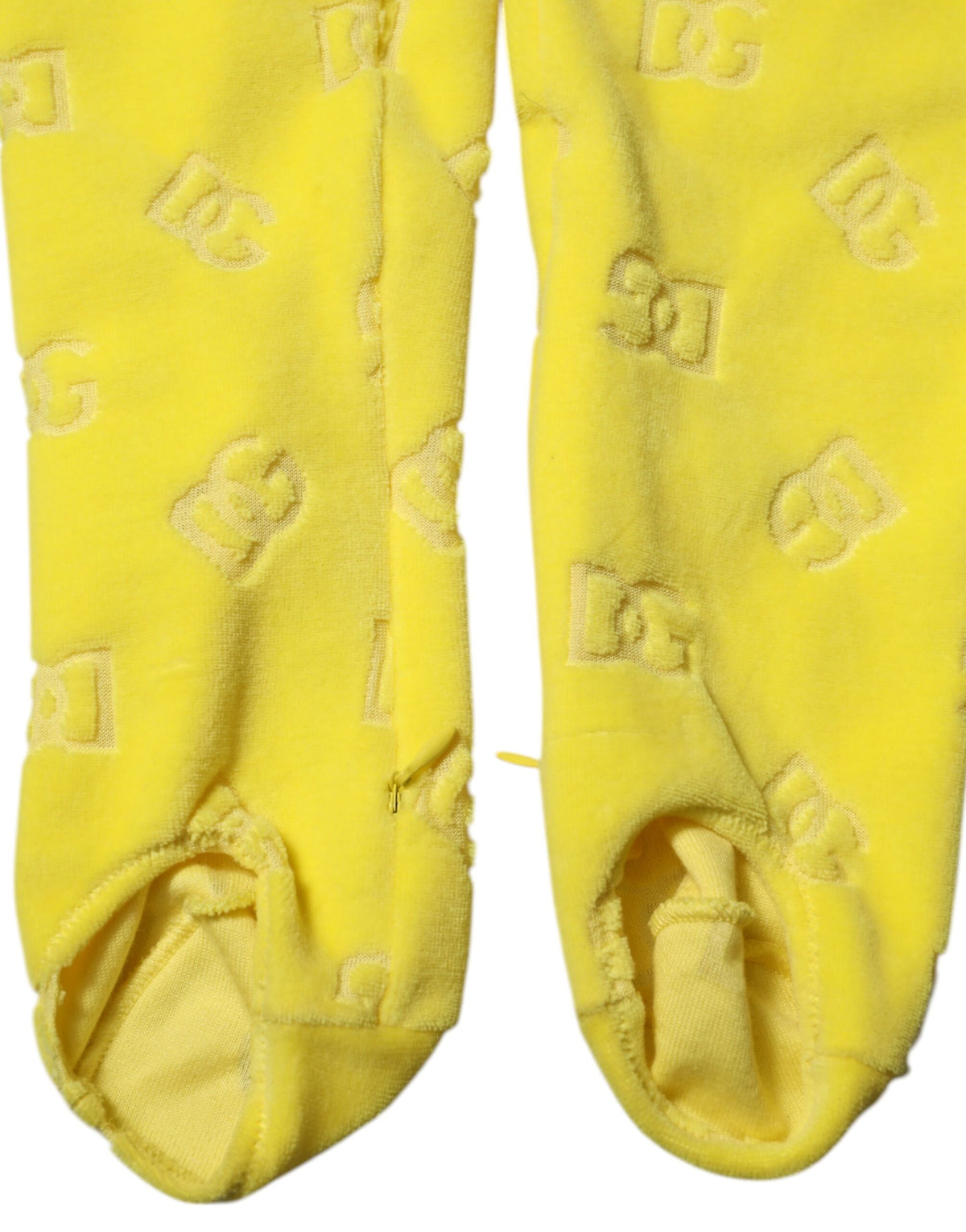 Experience the allure of Dolce & Gabbana's Yellow Logo Slim Fit Leggings Pants, crafted from luxurious cotton, embodying sophistication and timeless elegance for every occasion.