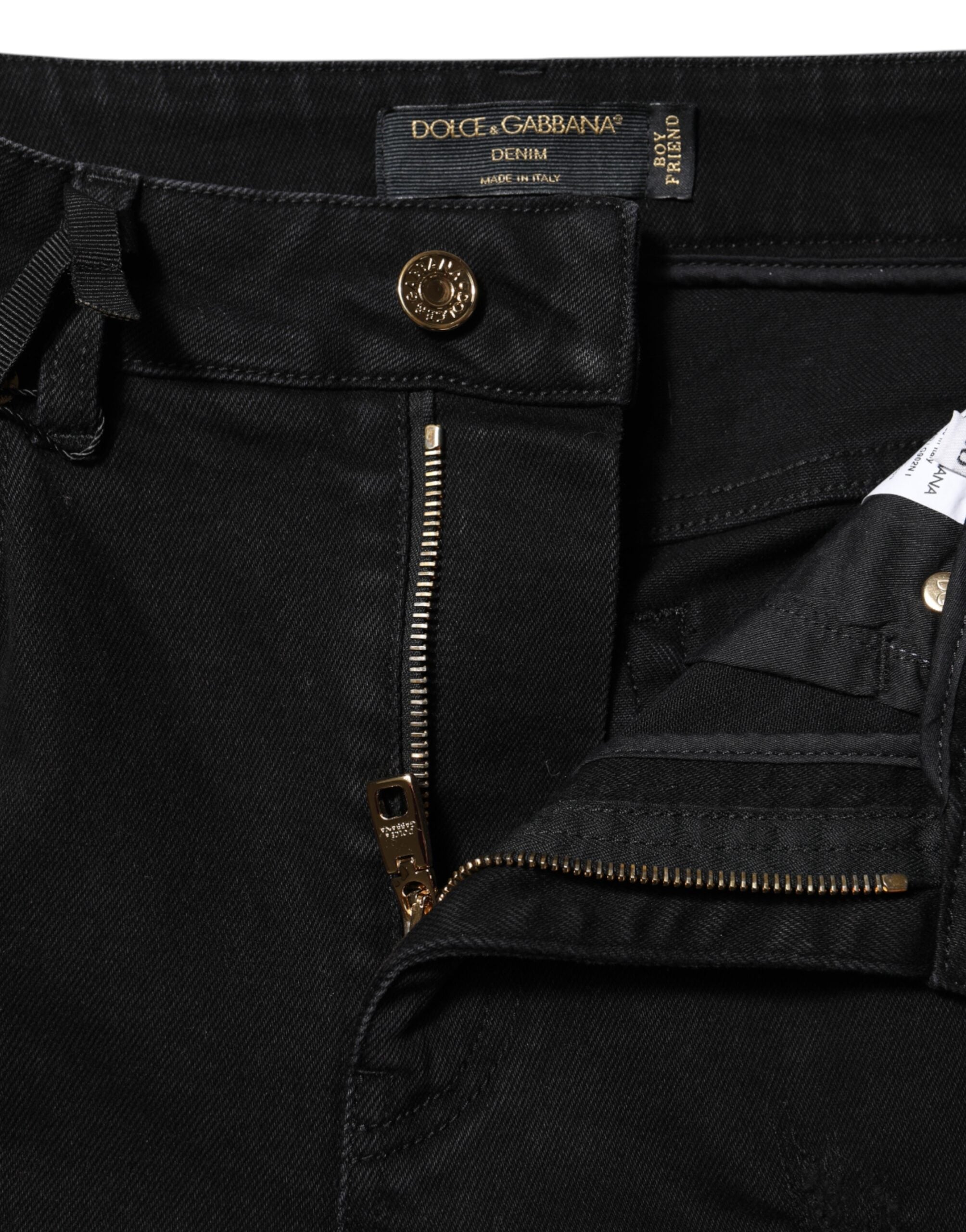 Experience the allure of Dolce & Gabbana's Black Boyfriend Cotton Flared Denim Jeans, crafted in Italy with luxurious materials for a silhouette that captivates and empowers.