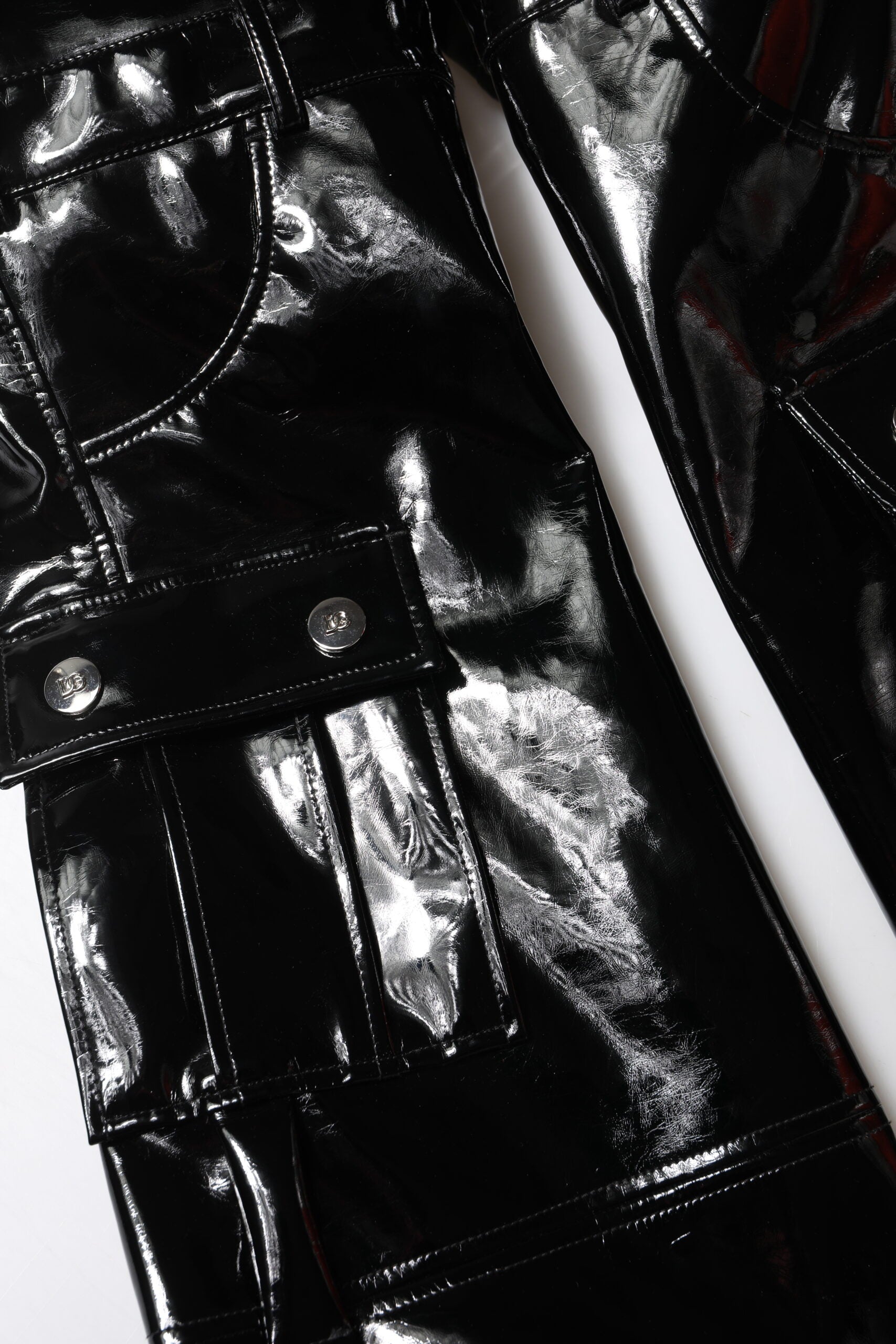 Indulge in the exquisite craftsmanship of Dolce & Gabbana's Black High Waist Cargo Bootcut Pants, where luxurious materials meet timeless elegance for the discerning individual.