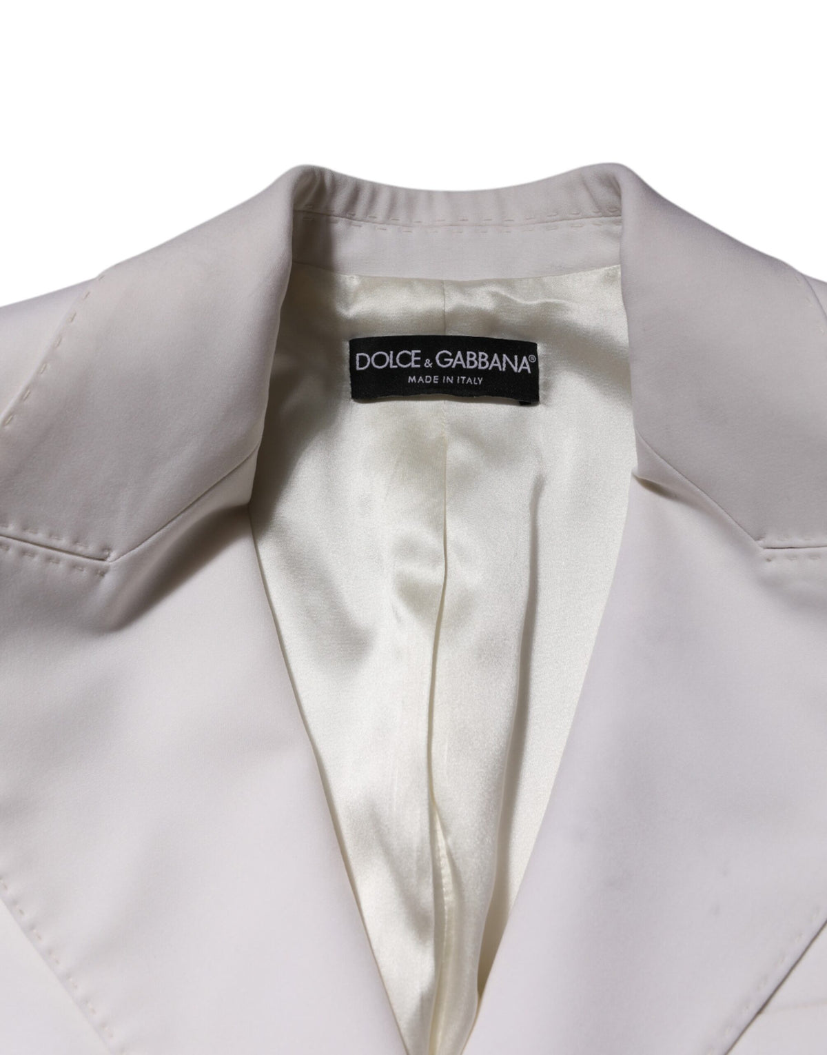 Experience the exquisite elegance of the Dolce & Gabbana White Wool Single Breasted Coat, crafted from luxurious materials for a refined, timeless allure.