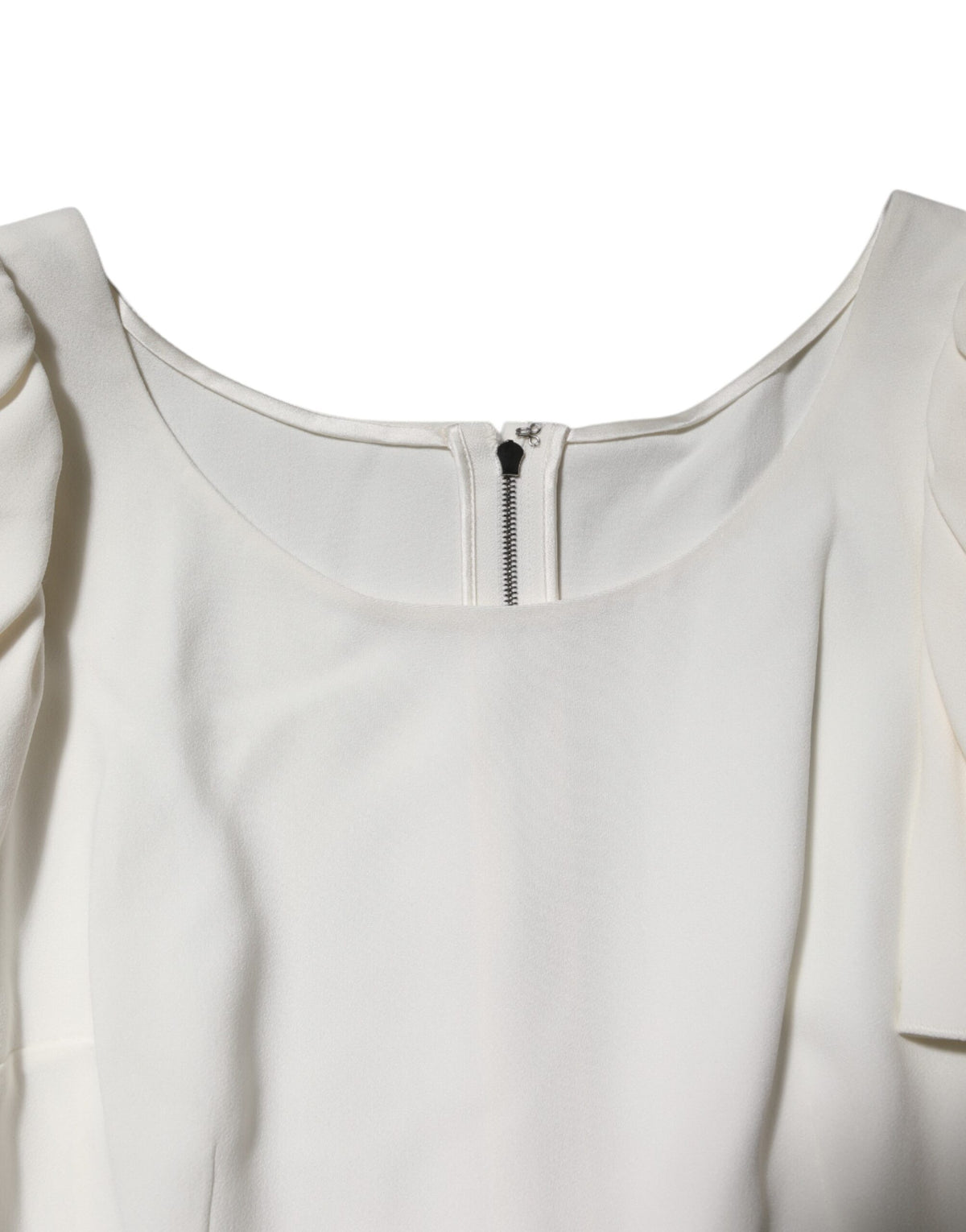 Experience the allure of Dolce & Gabbana's White Round Neck Blouse, crafted in Italy from a luxurious blend, embodying elegance and sophistication for every occasion.