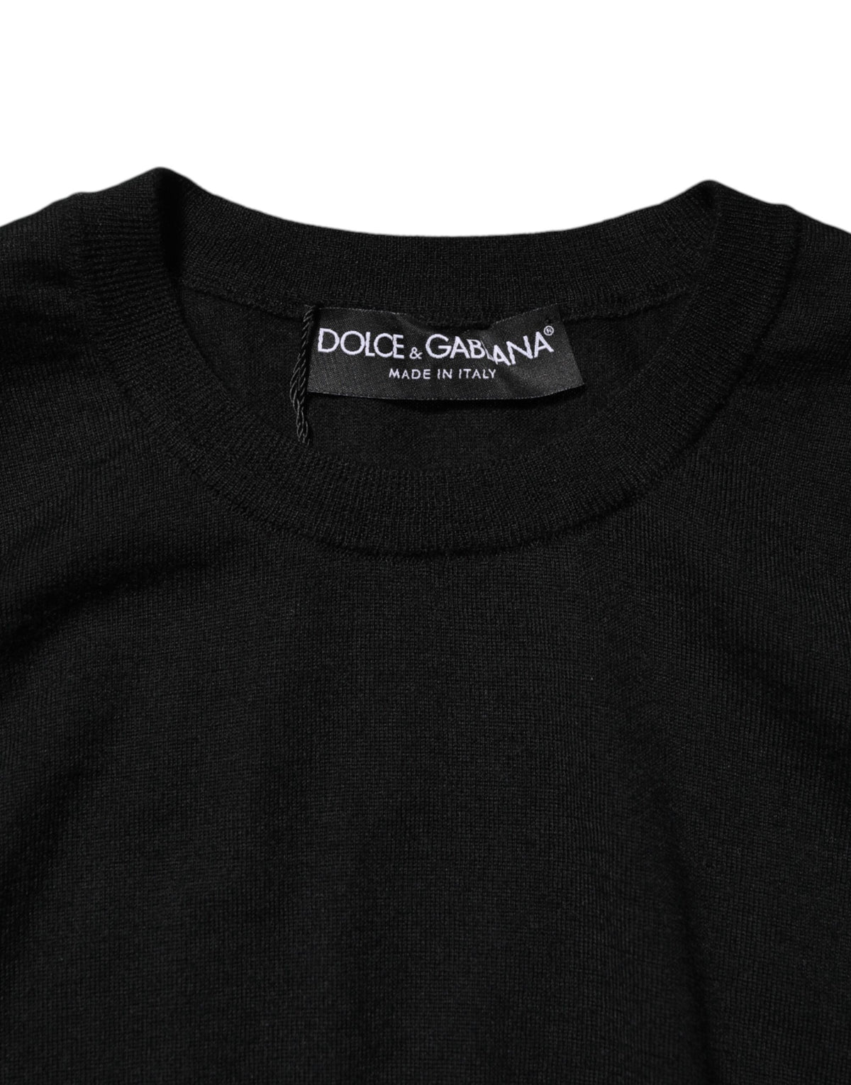 Indulge in the exquisite Dolce & Gabbana Black Cashmere Sleeveless Tank, a masterpiece of Italian craftsmanship that embodies timeless elegance and sophisticated allure.