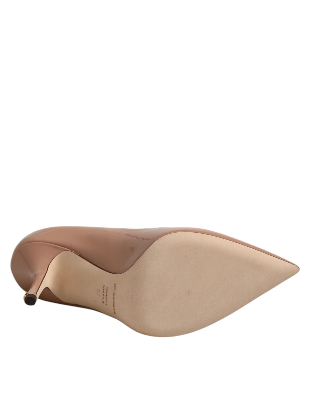 Elevate your elegance with Dolce & Gabbana's Beige Patent Leather Stiletto Heel Pumps, a masterpiece of Italian craftsmanship that embodies luxury and sophistication.