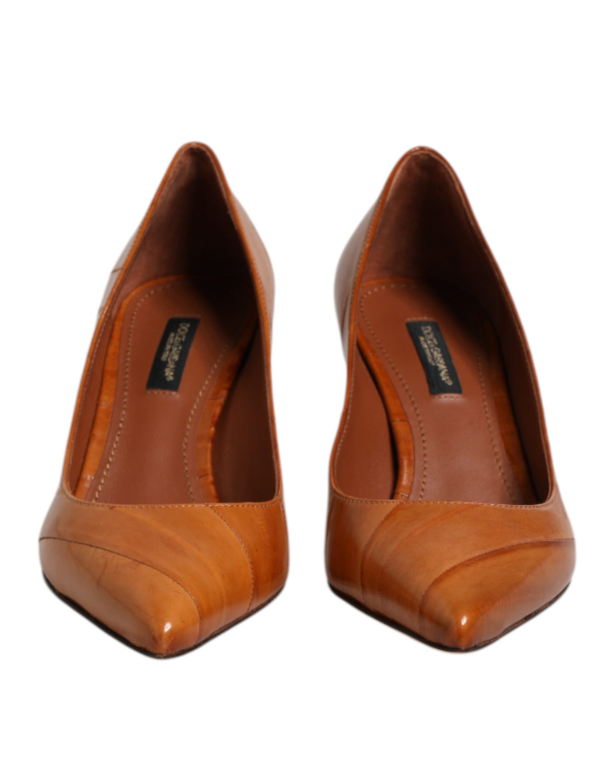 Experience the exquisite artistry of Dolce & Gabbana's Brown Leather Stiletto Heel Pumps, where Italian craftsmanship meets timeless elegance for the discerning individual.