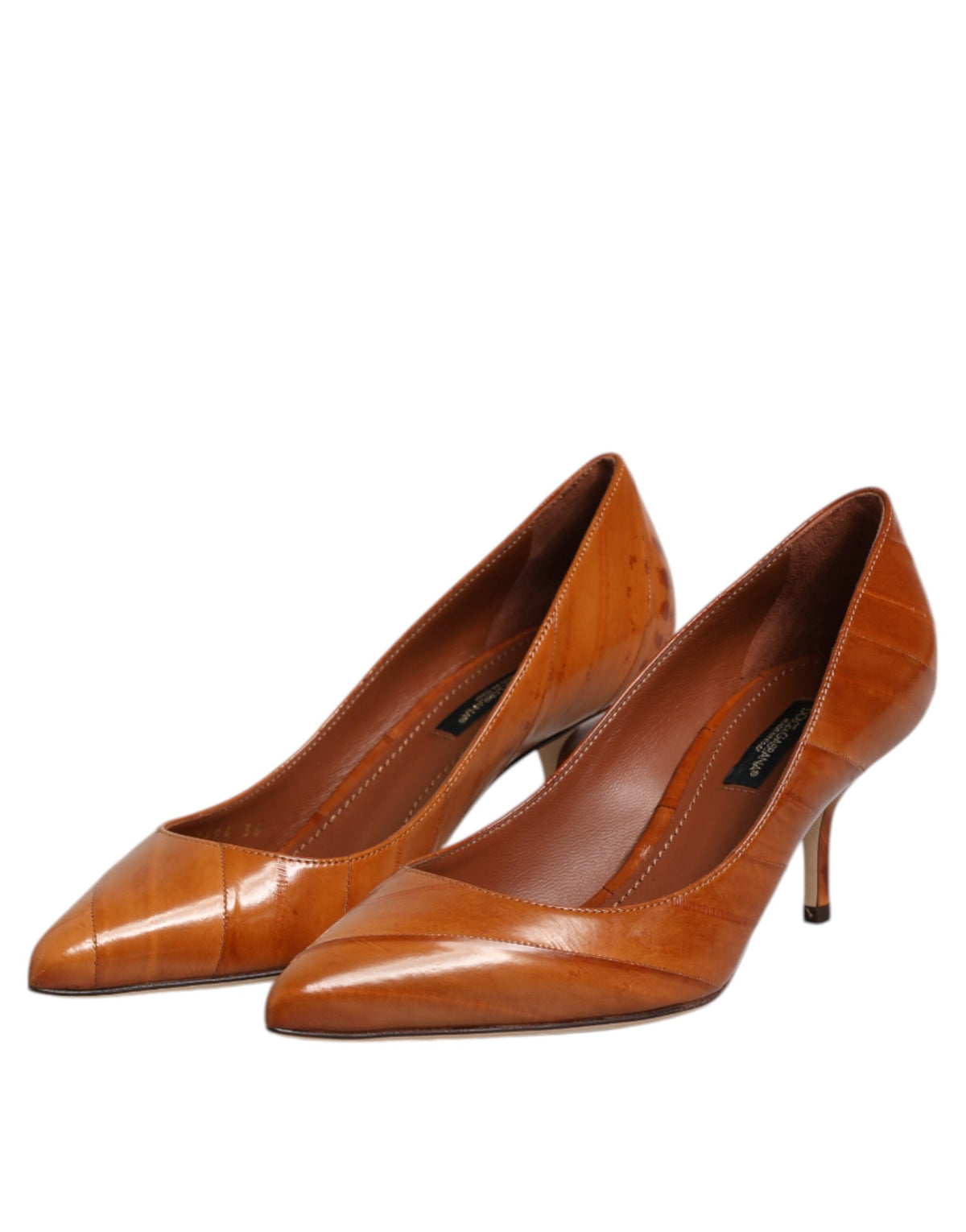 Experience the allure of Dolce & Gabbana's Brown Leather Stiletto Heel Pumps, where exquisite Italian craftsmanship meets timeless elegance for the discerning individual.