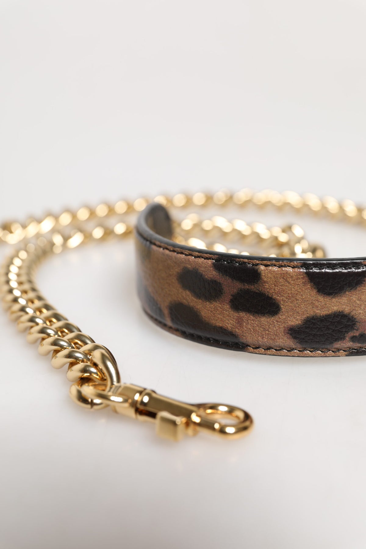 Elevate your style with the Dolce & Gabbana Brown Leopard Gold Brass Chain Accessory Shoulder Strap, a luxurious blend of calf leather and brass, crafted in Italy for the discerning connoisseur.