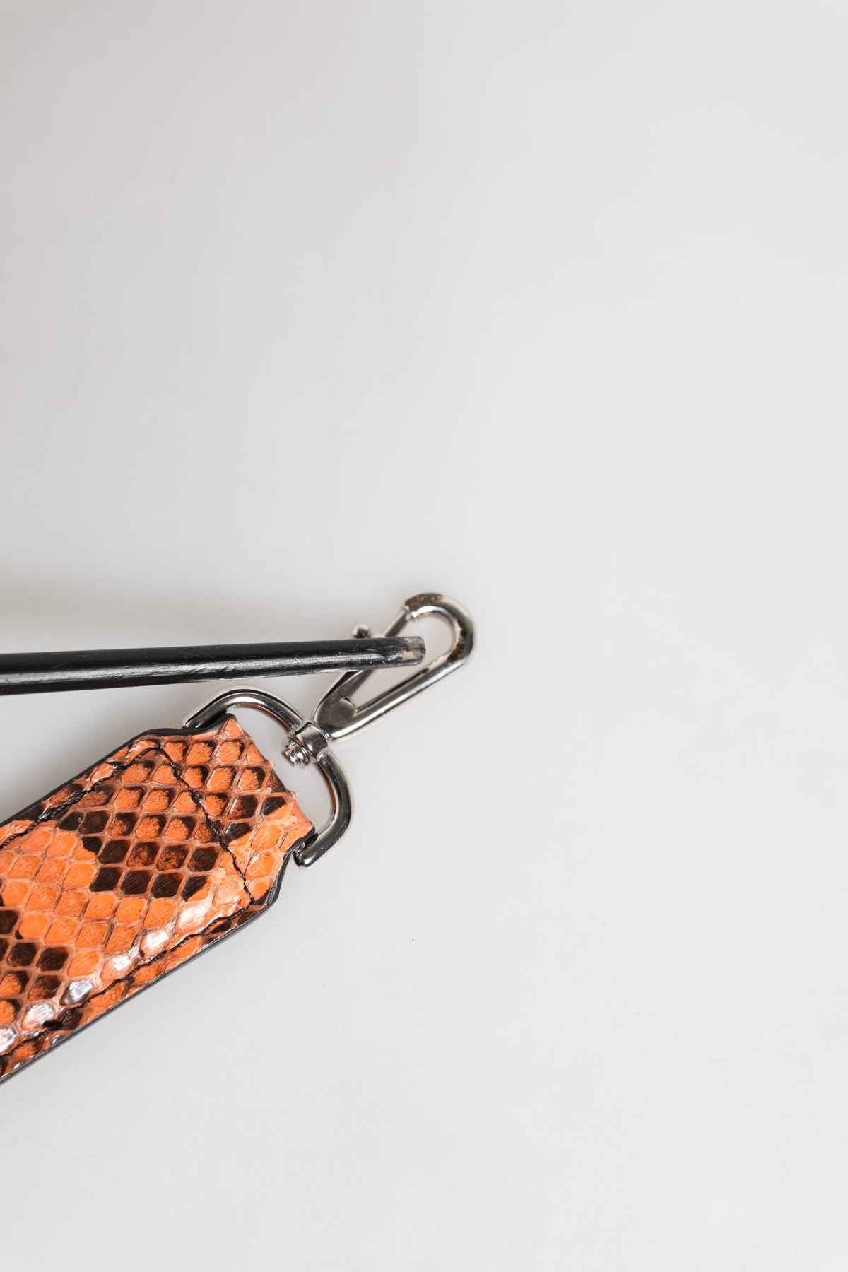 Elevate your style with the Dolce & Gabbana Orange Exotic Leather Bag Shoulder Strap, crafted from luxurious python leather, embodying bold elegance and timeless sophistication.
