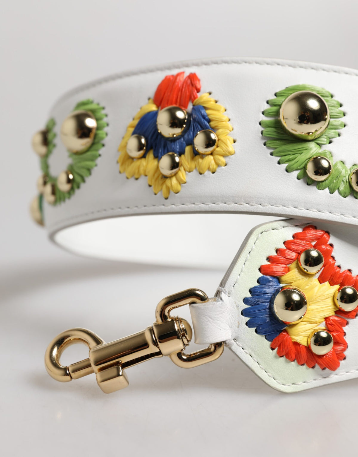 Indulge in the exquisite artistry of the Dolce & Gabbana White Calfskin Raffia Embroidered Patchwork Shoulder Strap, where luxurious craftsmanship meets timeless elegance for the discerning individual.