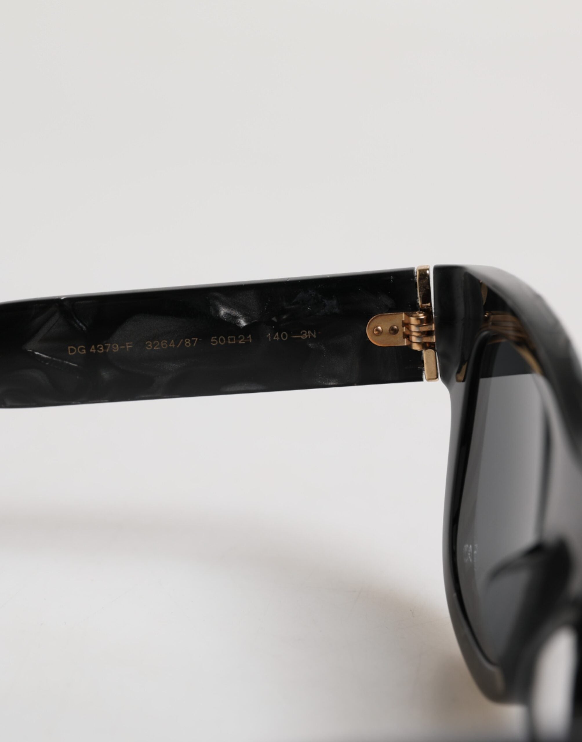 Indulge in the exquisite allure of Dolce & Gabbana Pearl White Acetate Frame Sunglasses, where timeless elegance meets modern sophistication, perfect for the discerning connoisseur.