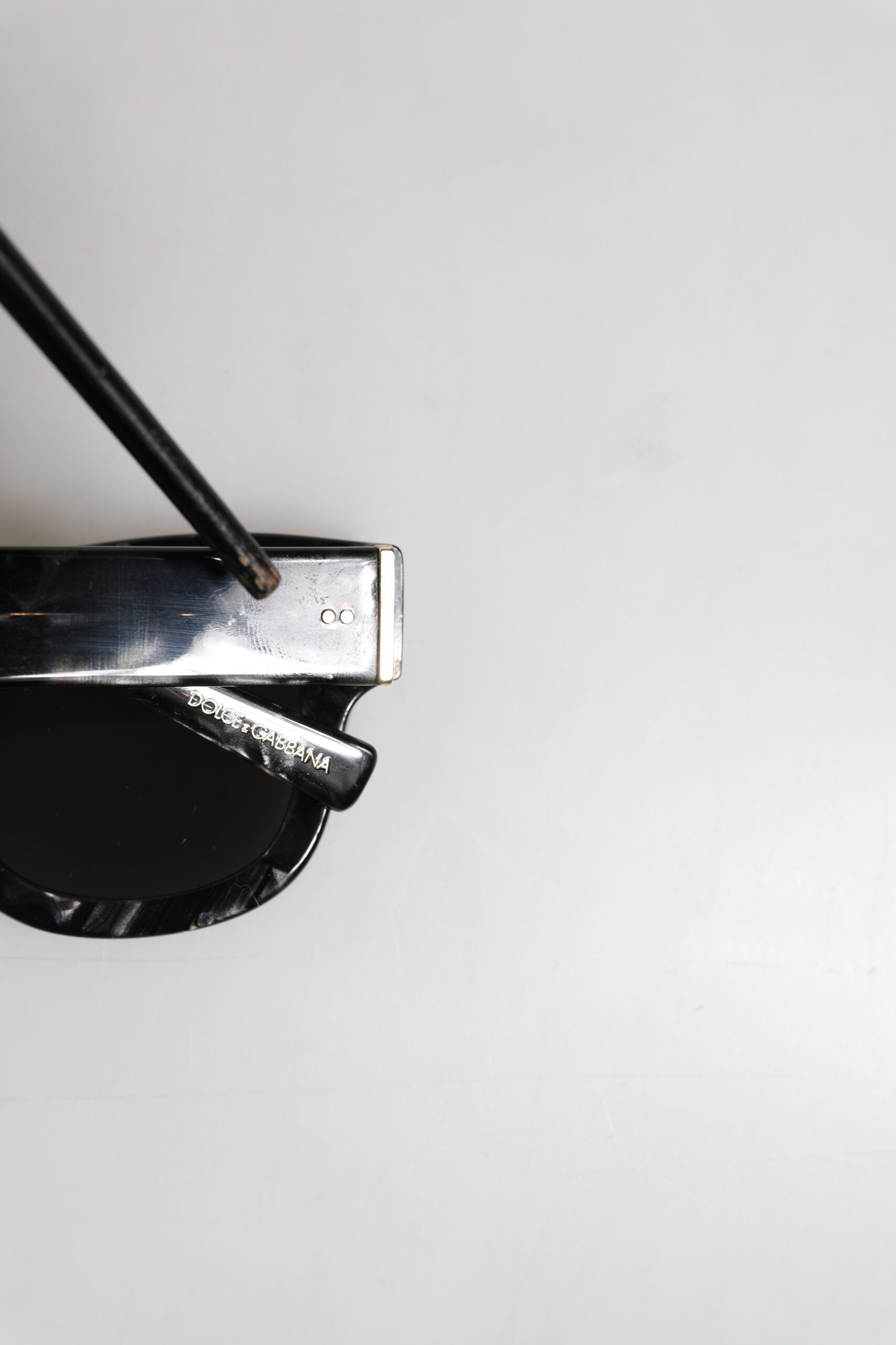 Indulge in the exquisite Dolce & Gabbana Pearl White Acetate Frame DG4379 sunglasses, where Italian craftsmanship meets timeless elegance, elevating your allure with every glance.