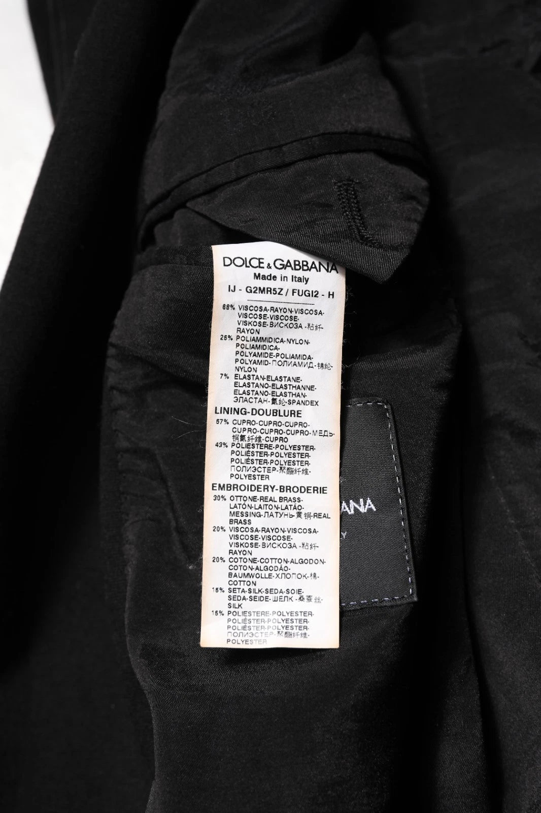 Indulge in the exquisite Dolce & Gabbana Black Viscose DG Crown Blazer, a masterpiece of Italian craftsmanship that elevates your style with timeless elegance and luxurious comfort.