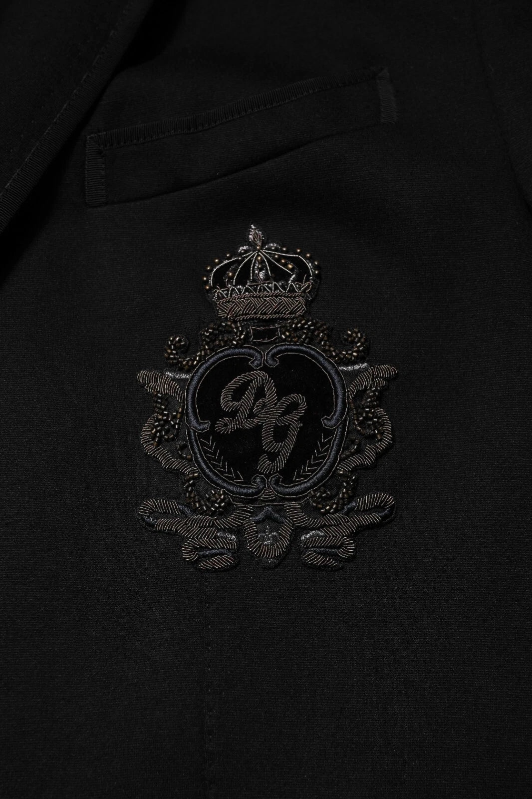 Elevate your wardrobe with the Dolce & Gabbana Black Viscose DG Crown Blazer, a masterpiece of Italian craftsmanship, blending luxury and timeless elegance for the discerning individual.