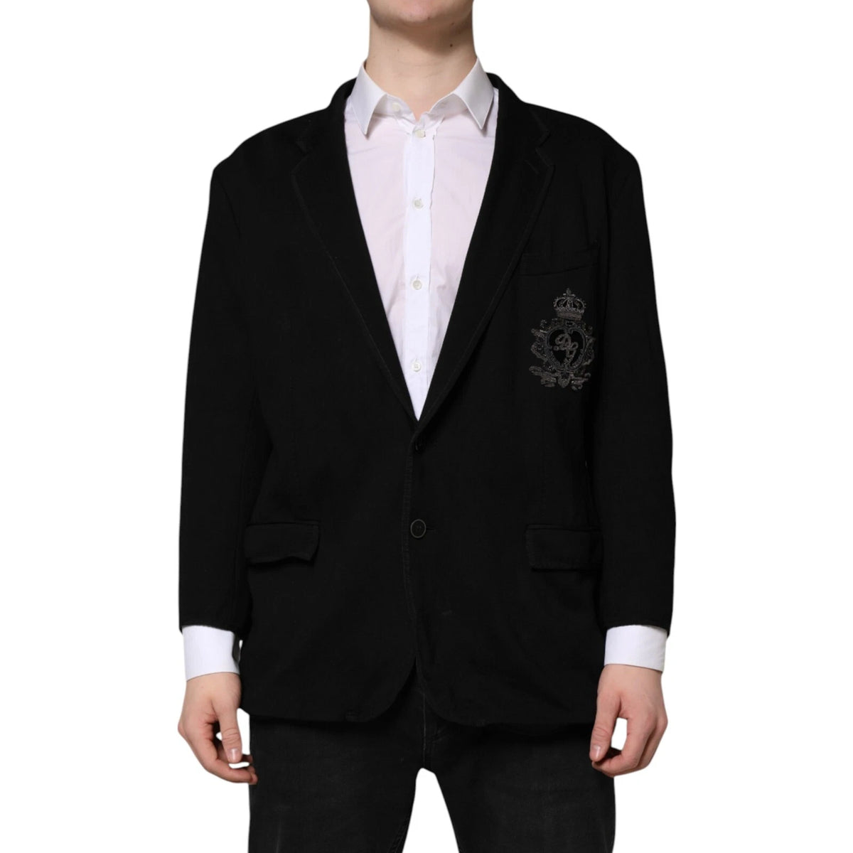 Discover the exquisite Dolce & Gabbana Black Viscose DG Crown Blazer, a timeless piece crafted in Italy, blending luxury and elegance for the discerning individual.