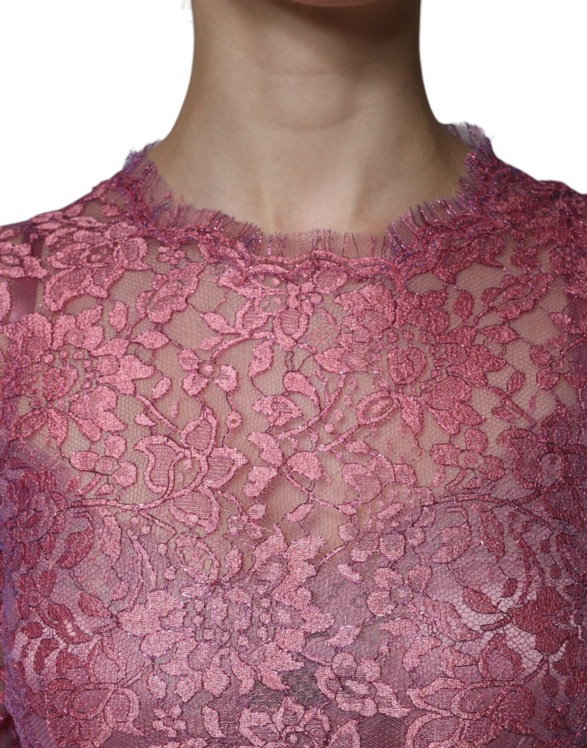 Experience the exquisite allure of the Dolce & Gabbana Pink Floral Lace Long Sleeve Midi Dress, a timeless masterpiece embodying romantic elegance and haute couture craftsmanship.