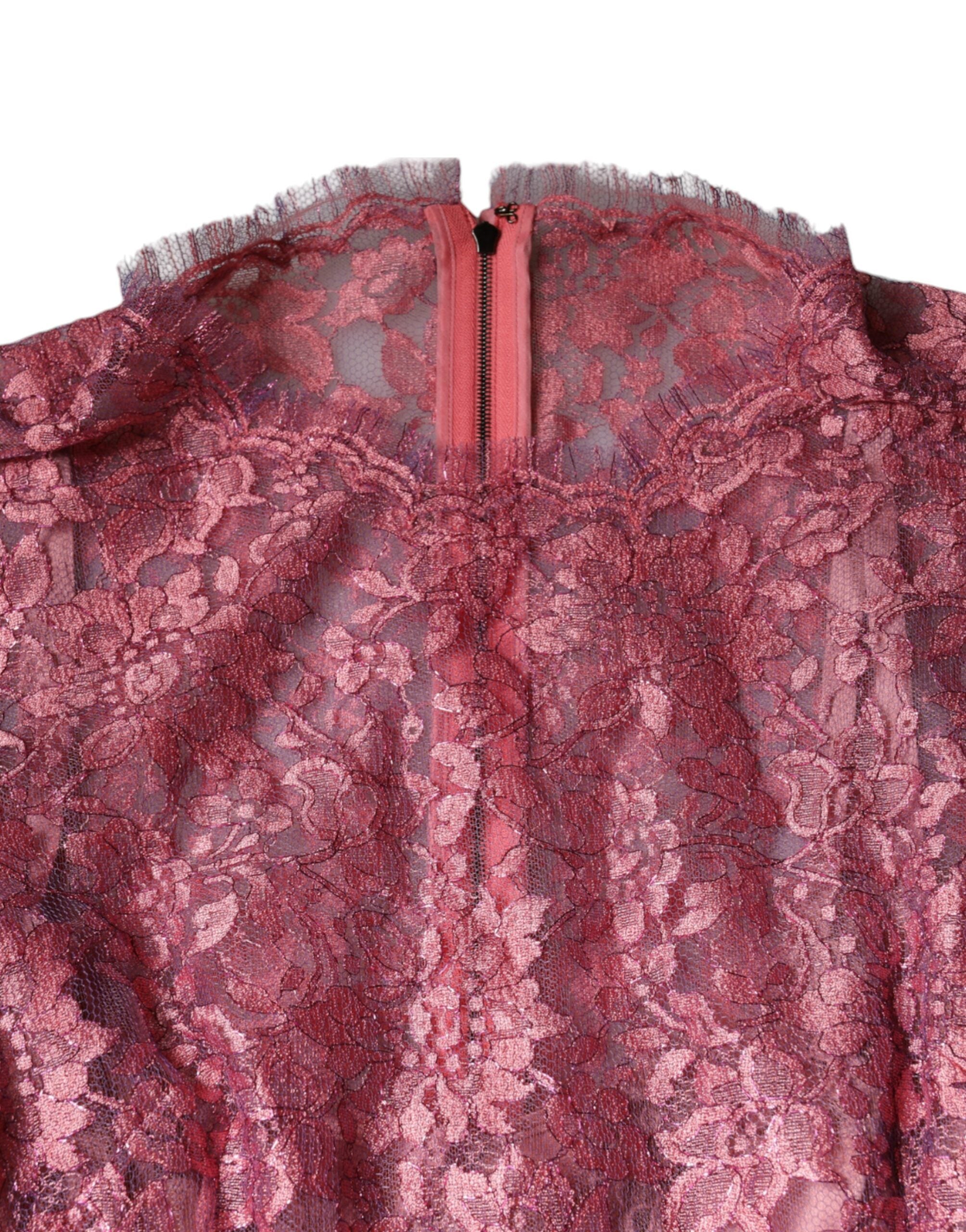 Experience the exquisite allure of Dolce & Gabbana's Pink Floral Lace Long Sleeve Midi Dress, a timeless piece that embodies romantic elegance and haute couture craftsmanship.