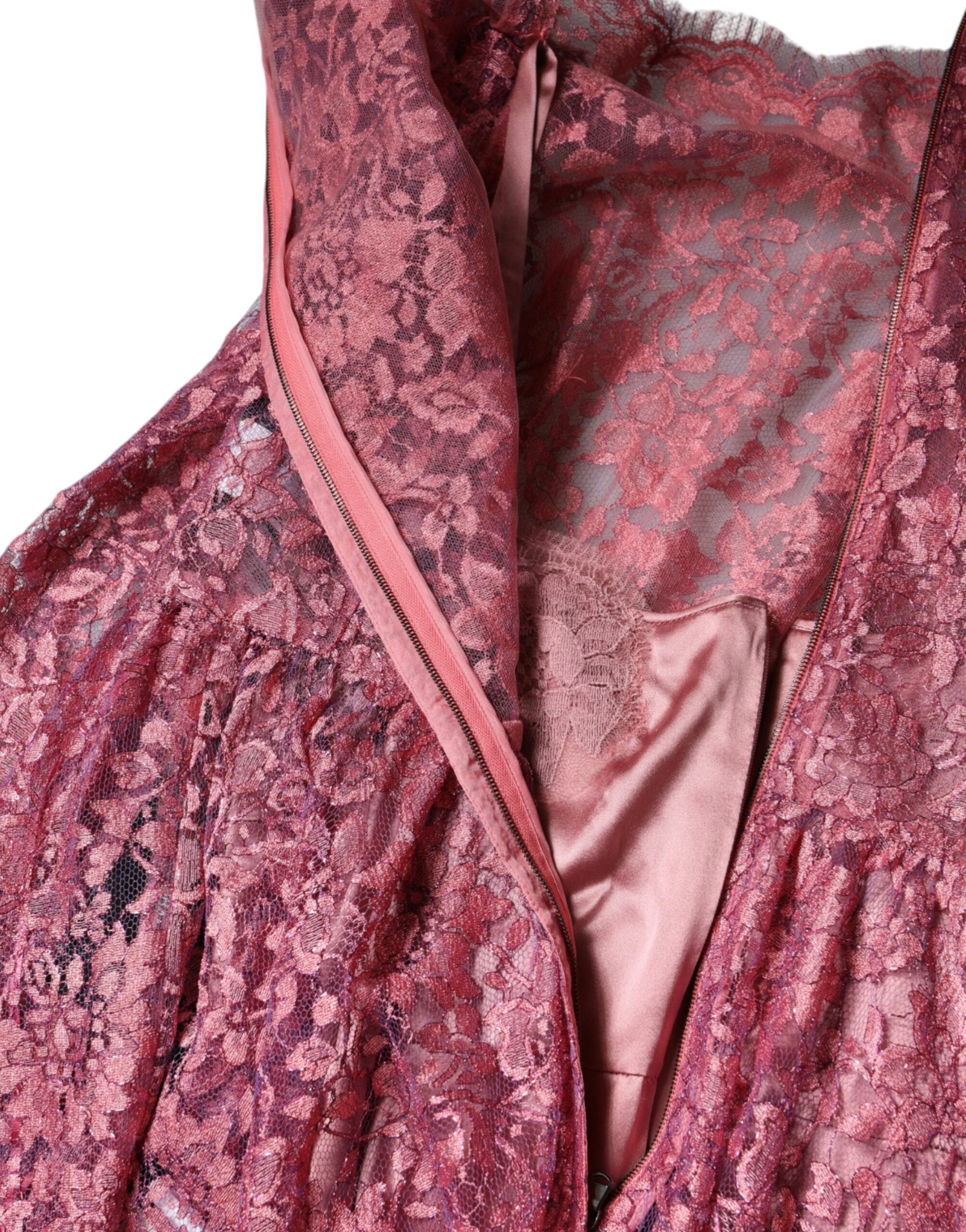Experience the exquisite allure of the Dolce & Gabbana Pink Floral Lace Long Sleeve Midi Dress, a timeless haute couture masterpiece that embodies romantic sophistication and unparalleled craftsmanship.