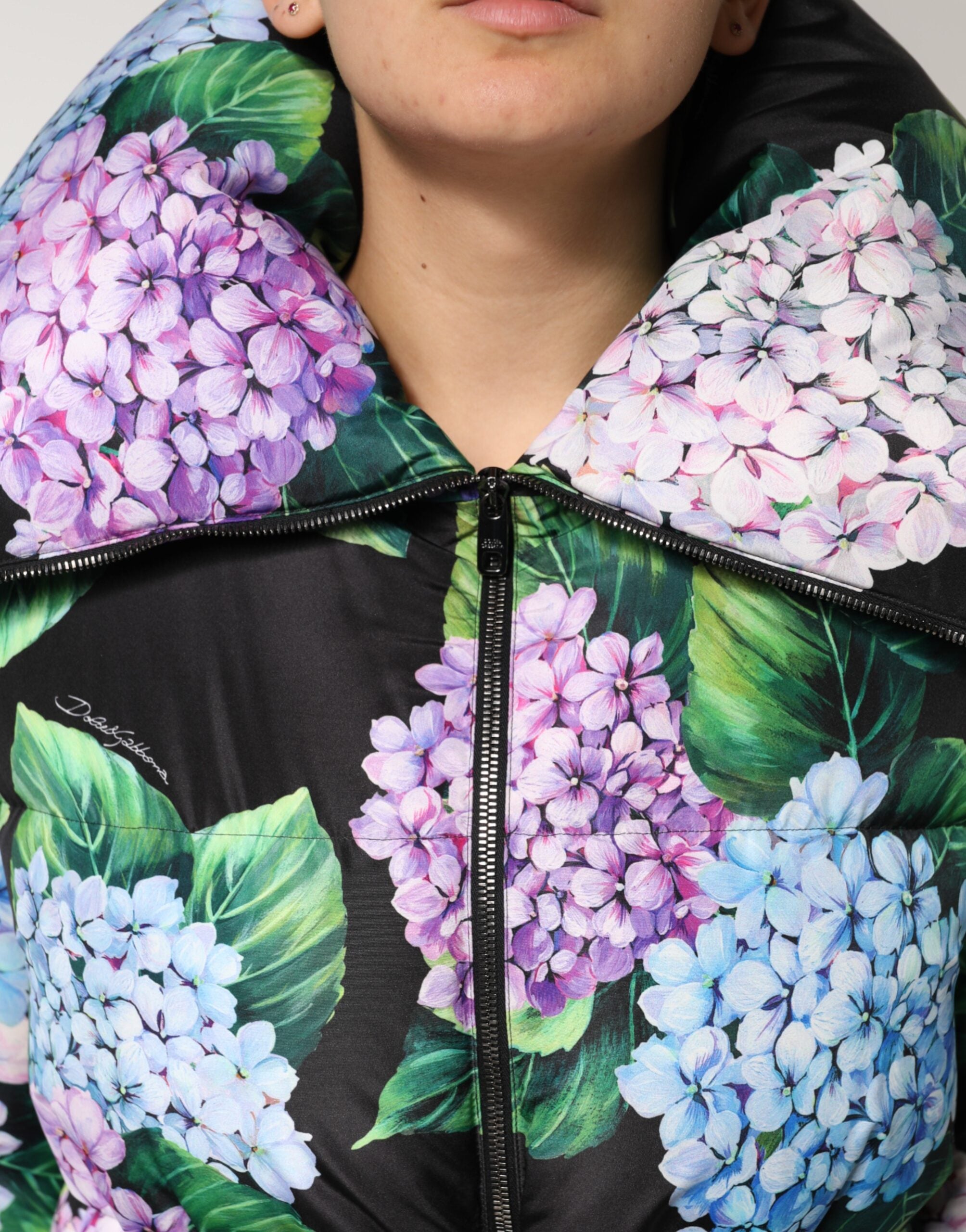 Elevate your wardrobe with the Dolce & Gabbana Multicolor Floral Print Puffer Quilted Jacket, a luxurious blend of exquisite craftsmanship and captivating style, perfect for any occasion.