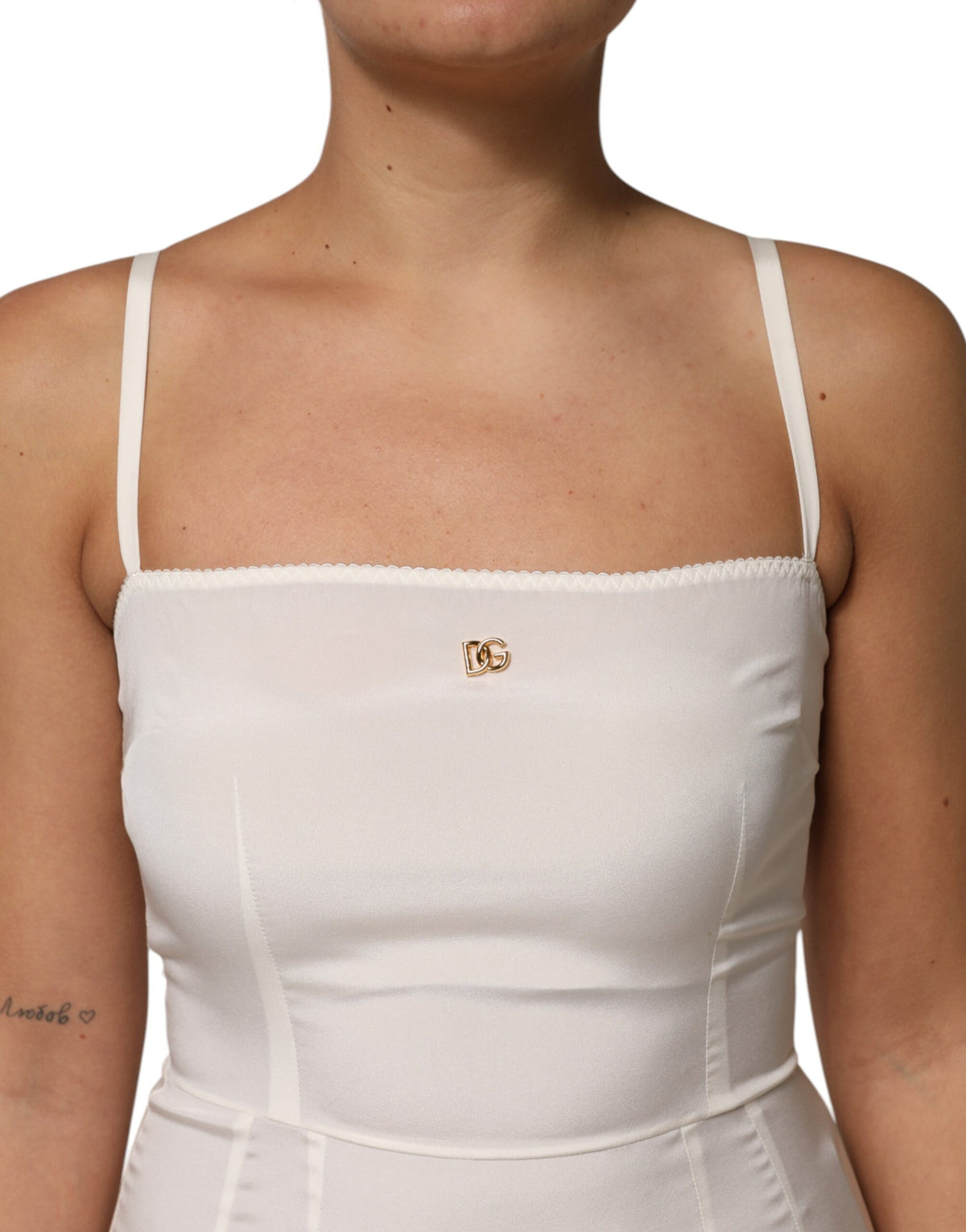 Experience the allure of Dolce & Gabbana's White Full Slip Silk Dress, where exquisite silk meets timeless elegance, perfect for elevating any sophisticated occasion.