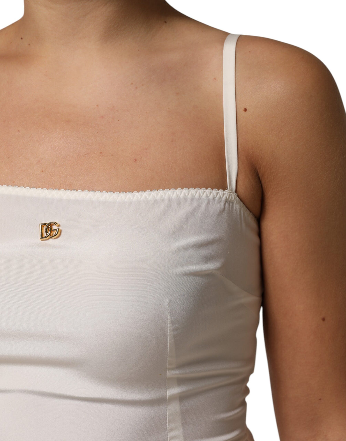 Experience the allure of Dolce & Gabbana's White Full Slip Silk Dress, a masterpiece of Italian craftsmanship that redefines luxury and elegance for every occasion.