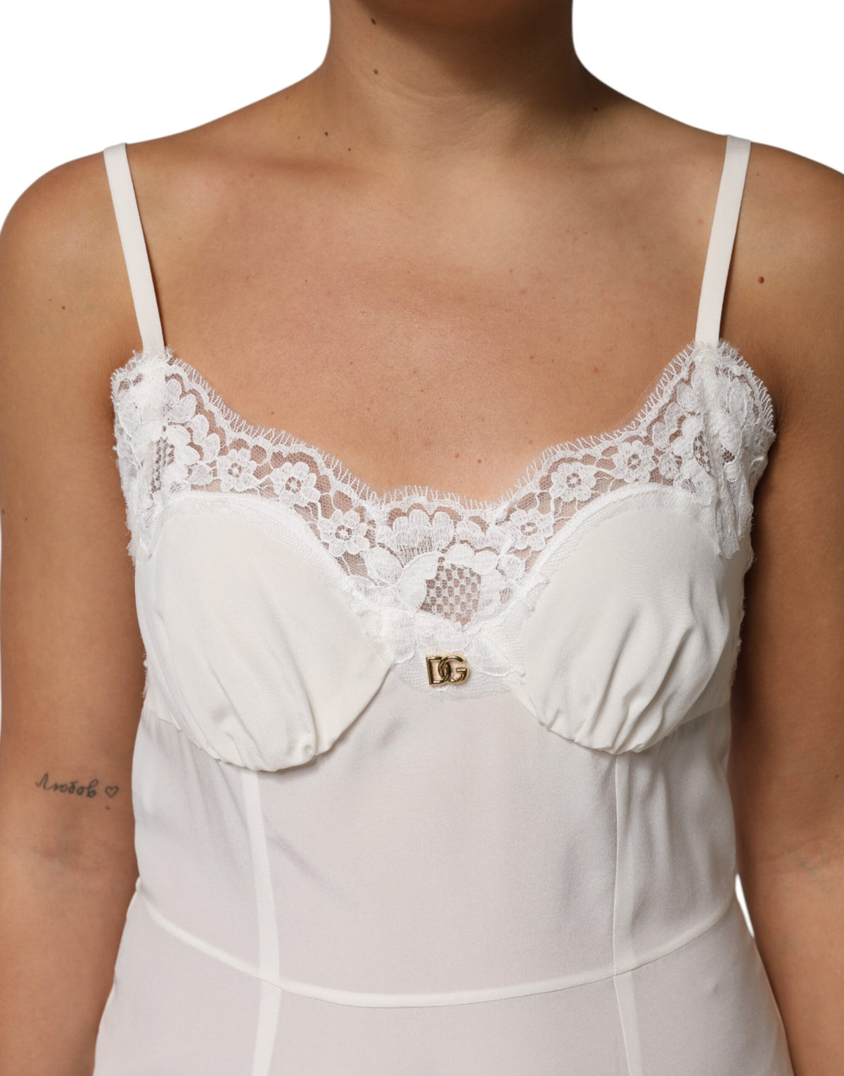 Indulge in the exquisite Dolce & Gabbana White Lace Gold DG Logo Silk Dress Sleepwear, a handcrafted masterpiece that embodies timeless elegance and refined sensuality.