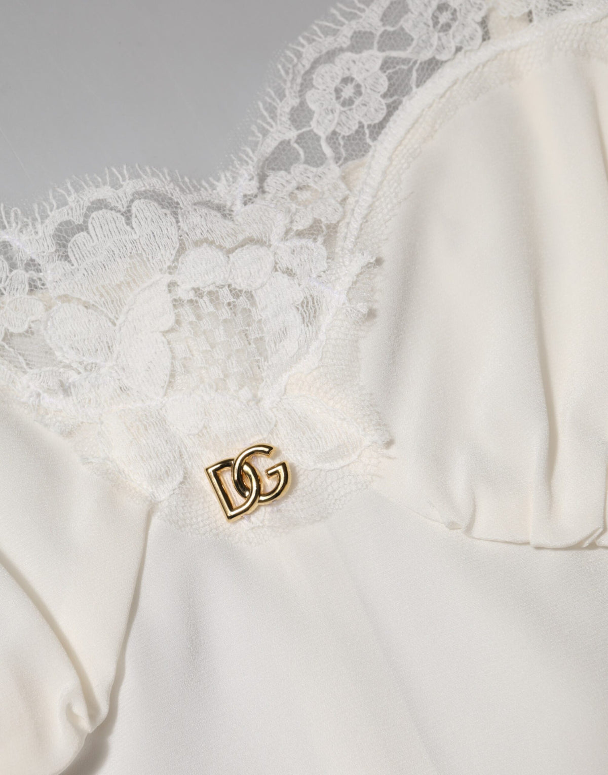 Indulge in the exquisite Dolce & Gabbana White Lace Gold DG Logo Silk Dress Sleepwear, where luxurious silk and intricate lace redefine elegance for enchanting evenings.