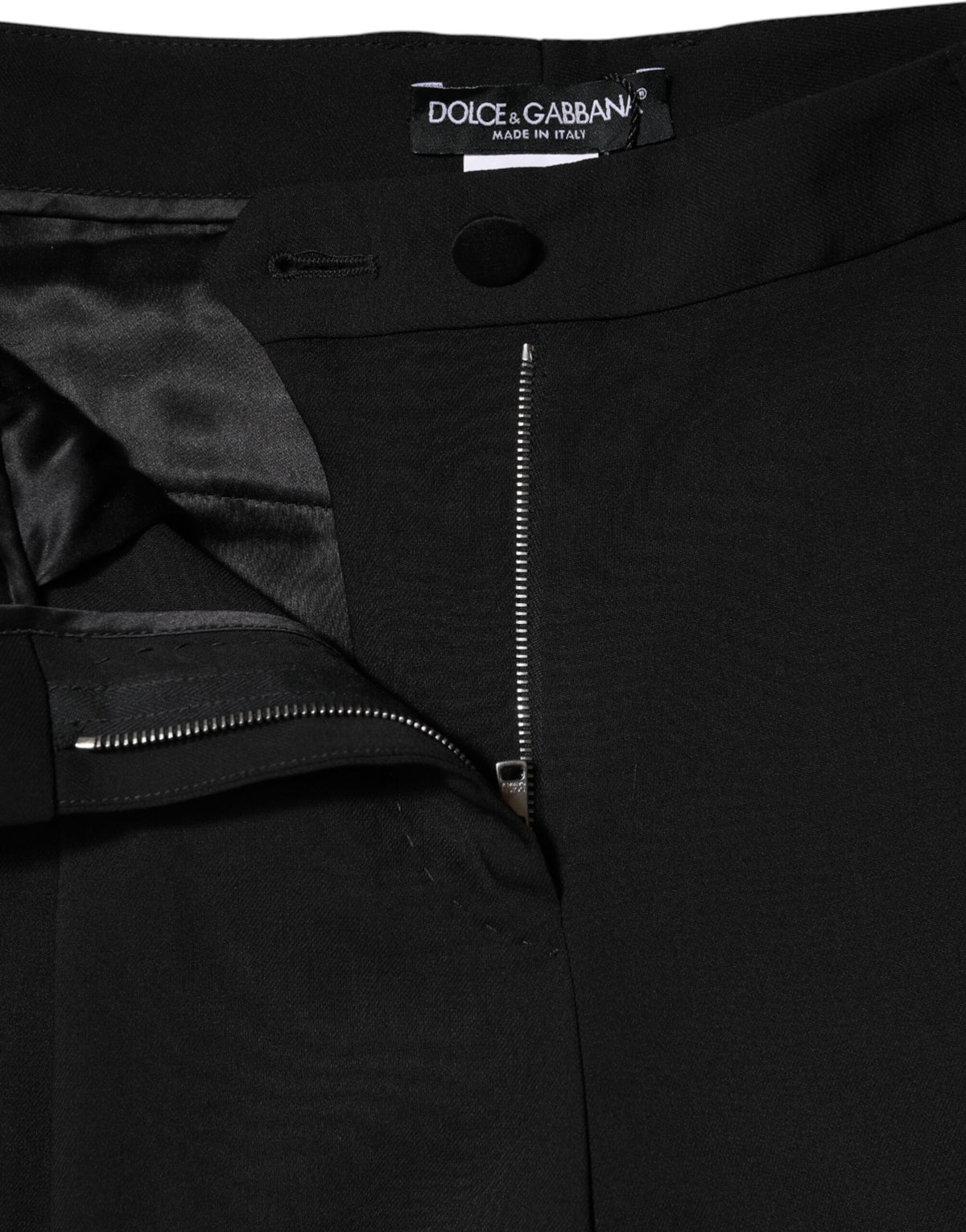 Indulge in the exquisite Dolce & Gabbana Black Wool High Waist Wide Leg Pants, a luxurious blend of virgin wool and silk, crafted for timeless elegance and sophistication.