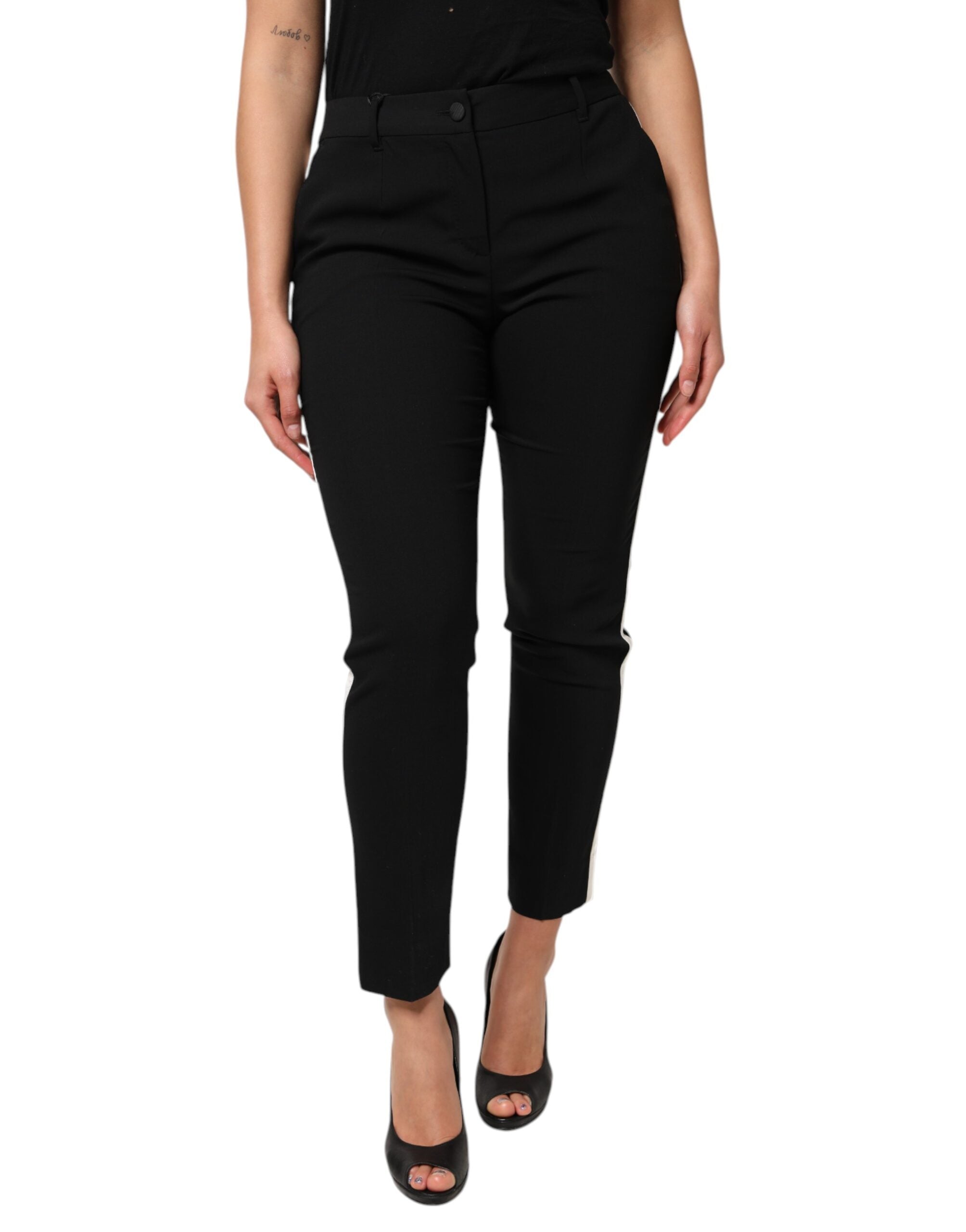 Elevate your wardrobe with Dolce & Gabbana's Black Wool High Waist Tapered Pants, a masterpiece of Italian craftsmanship blending virgin wool and silk for timeless sophistication.