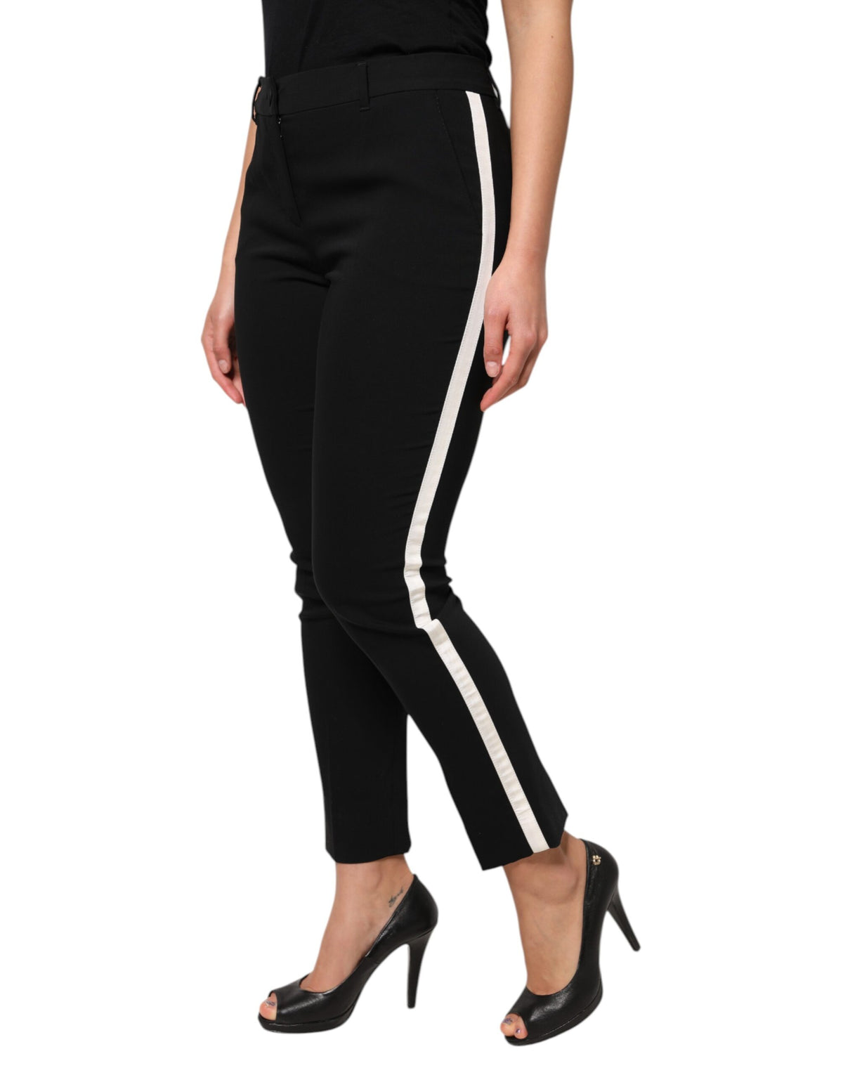 Elevate your wardrobe with Dolce & Gabbana's Black Wool High Waist Tapered Pants, a masterpiece of Italian craftsmanship blending virgin wool and silk for timeless elegance.