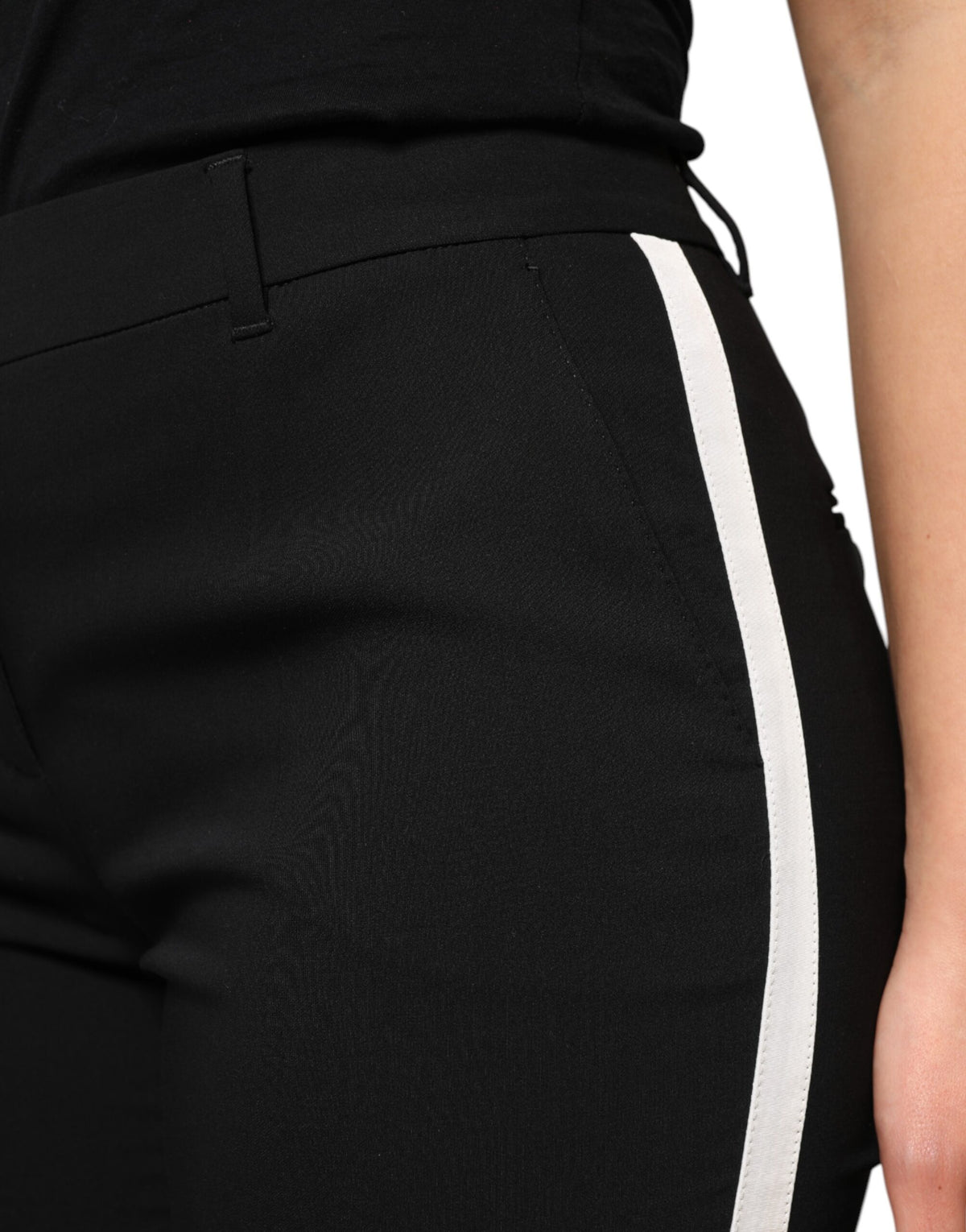 Elevate your wardrobe with Dolce & Gabbana's Black Wool High Waist Tapered Pants, a masterpiece of Italian craftsmanship blending virgin wool and silk for timeless sophistication.