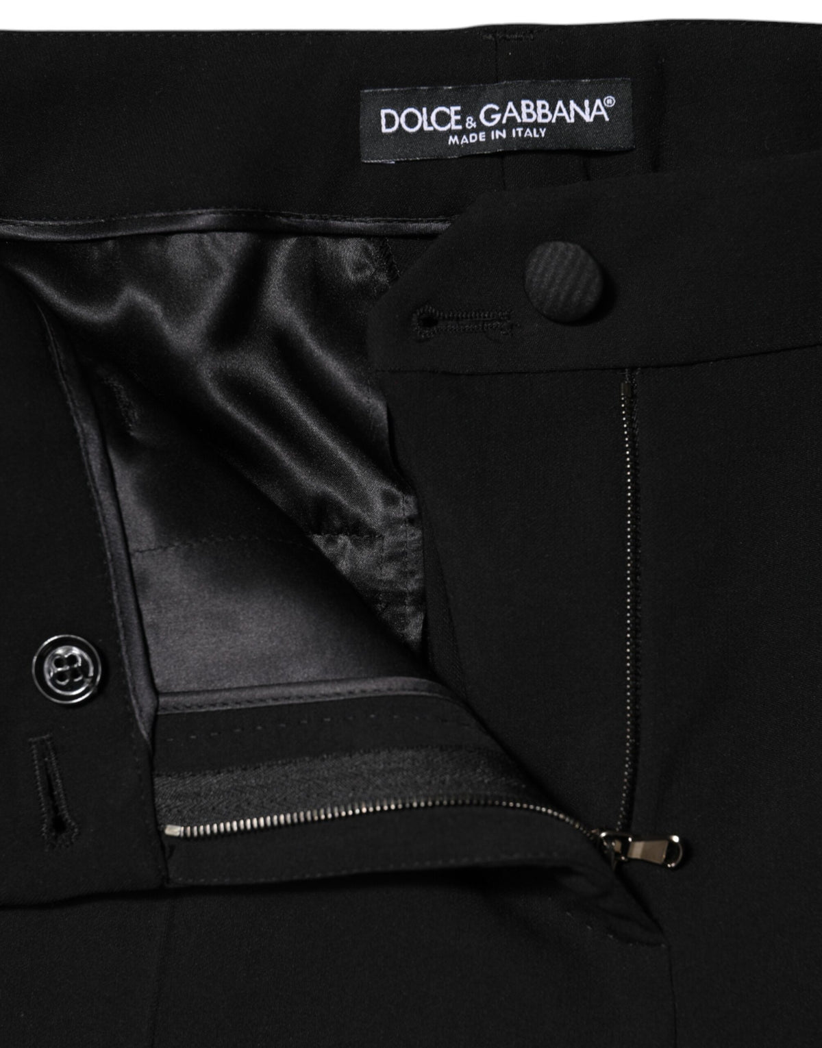 Experience the allure of Dolce & Gabbana's Black Wool High Waist Tapered Pants, crafted from an exquisite blend of virgin wool and silk for timeless elegance.