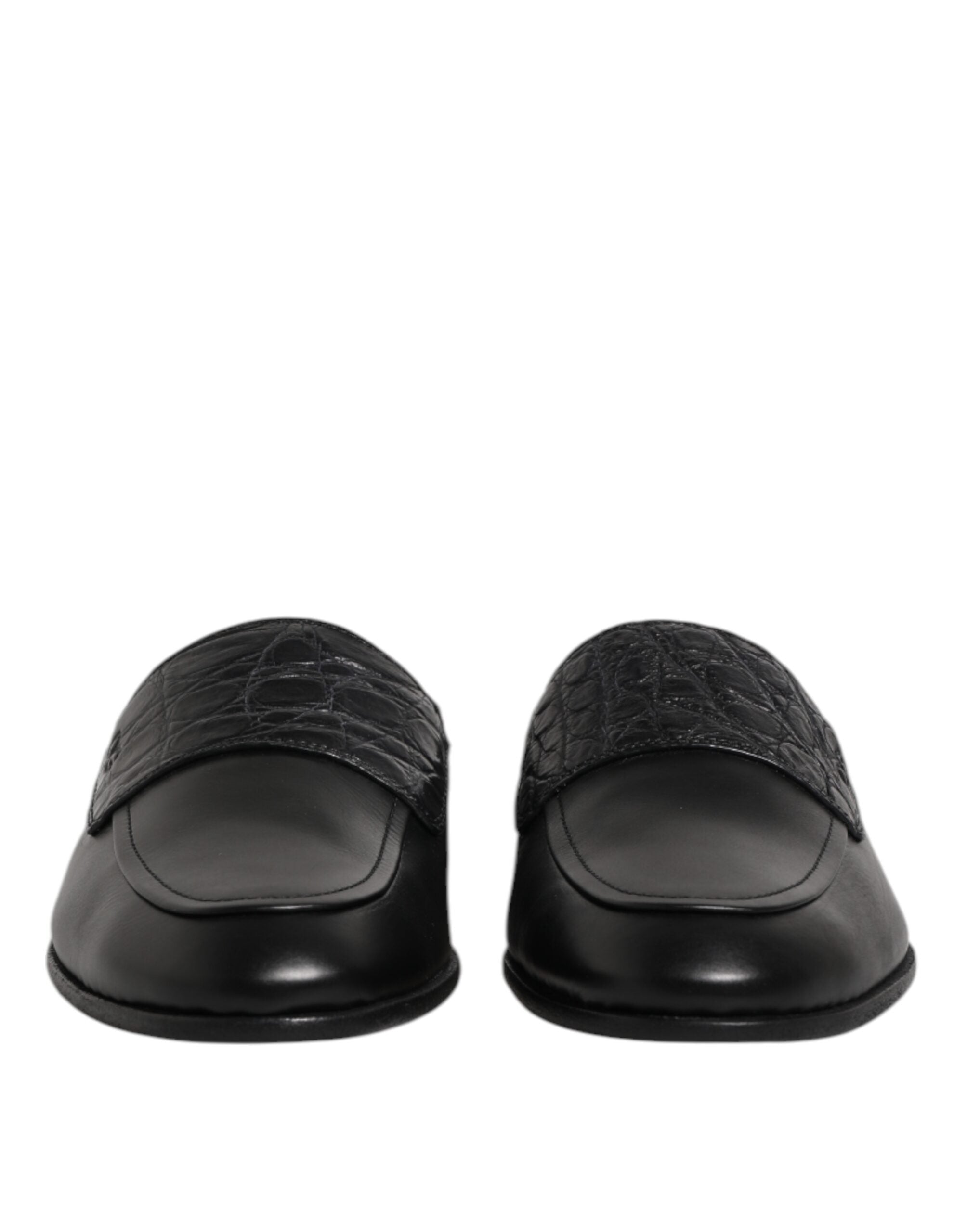 Experience the exquisite craftsmanship of Dolce & Gabbana's Black Calfskin Leather Slip On Loafers, where timeless elegance meets luxurious comfort for the discerning individual.