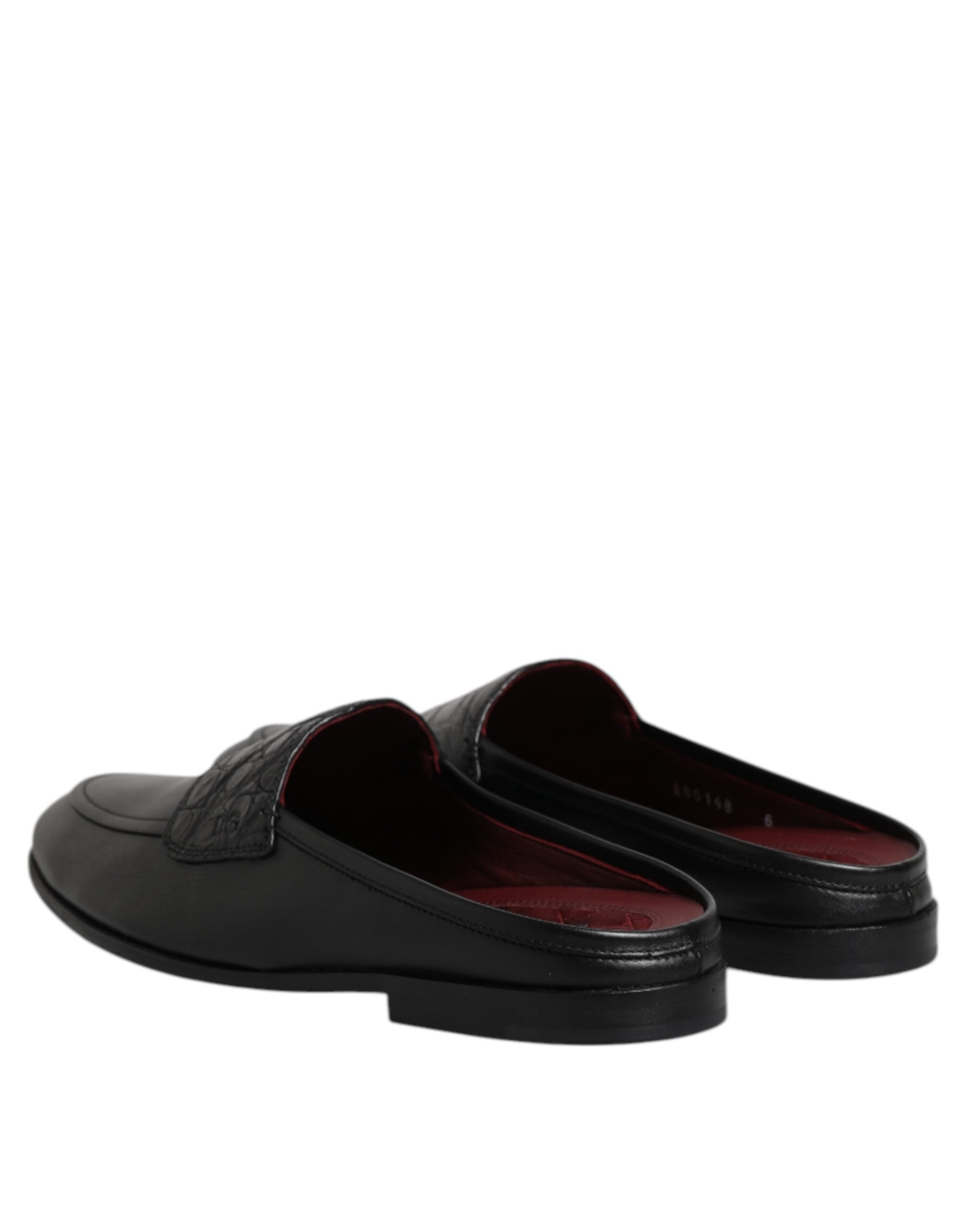 Experience the exquisite craftsmanship of Dolce & Gabbana's Black Calfskin Leather Slip On Loafers, where timeless elegance meets luxurious comfort for the discerning individual.