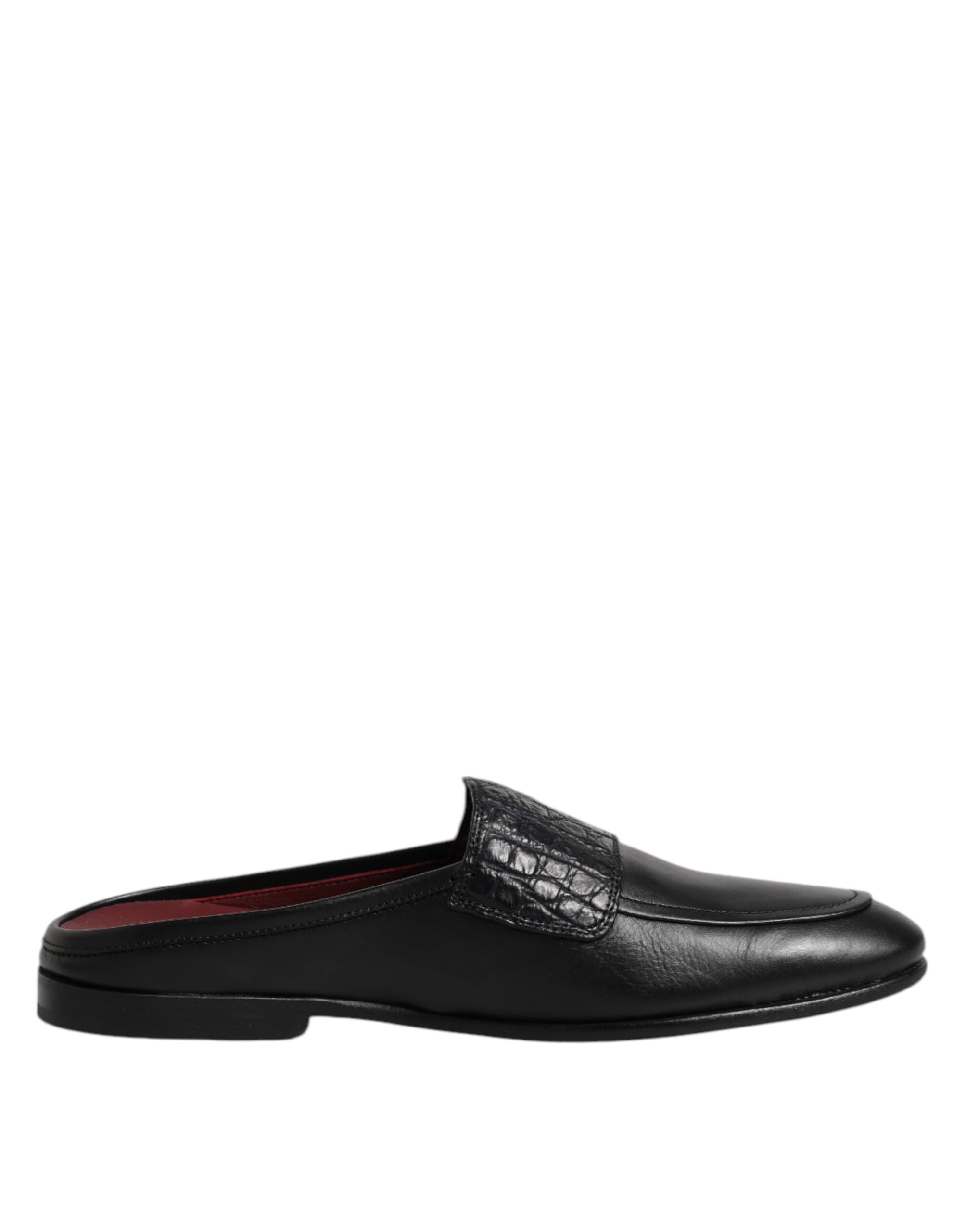 Experience the exquisite craftsmanship of Dolce & Gabbana's Black Calfskin Leather Slip On Loafers, where timeless elegance meets luxurious comfort for the discerning individual.