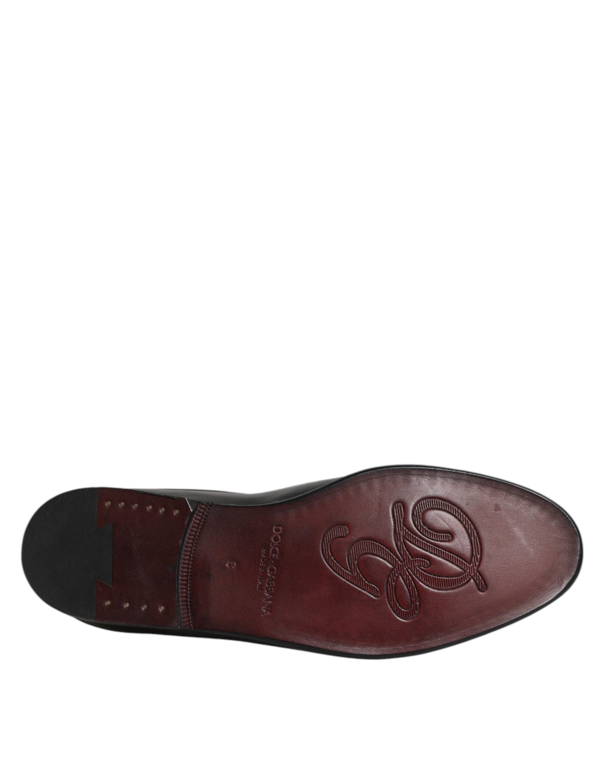 Experience the allure of Dolce & Gabbana's Black Calfskin Leather Slip On Loafers, where exquisite craftsmanship meets timeless elegance, perfect for the discerning individual.