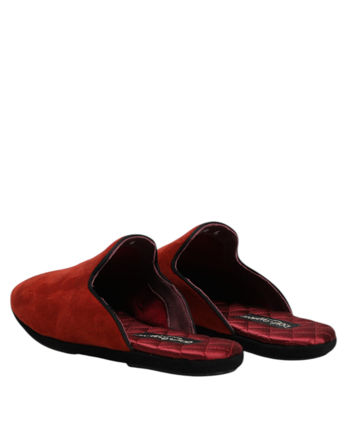Experience the exquisite Dolce & Gabbana Orange Suede Slides, crafted from 100% Capra leather, embodying Italian artistry and luxurious comfort for the discerning individual.