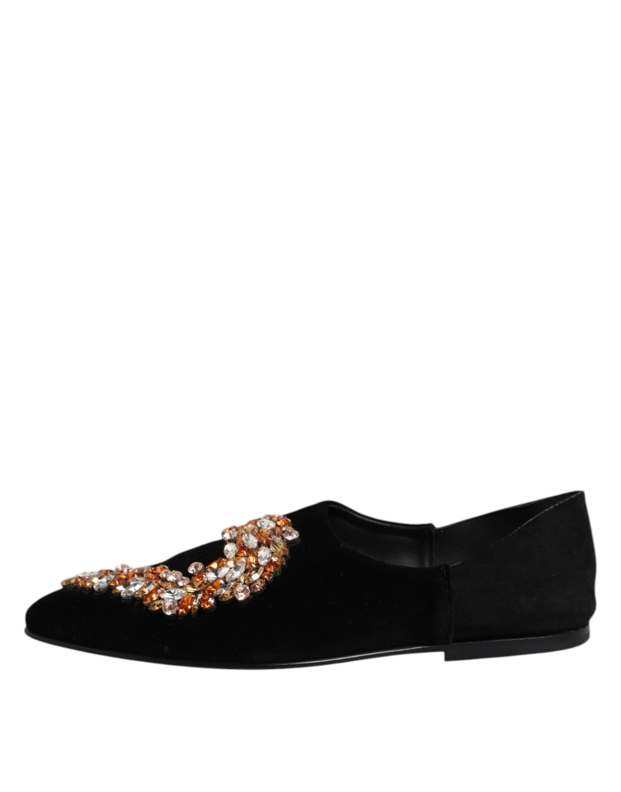 Elevate your style with Dolce & Gabbana's Black Velvet Embellished Loafer Slip On Shoes, a luxurious blend of exquisite craftsmanship and timeless elegance, perfect for any occasion.