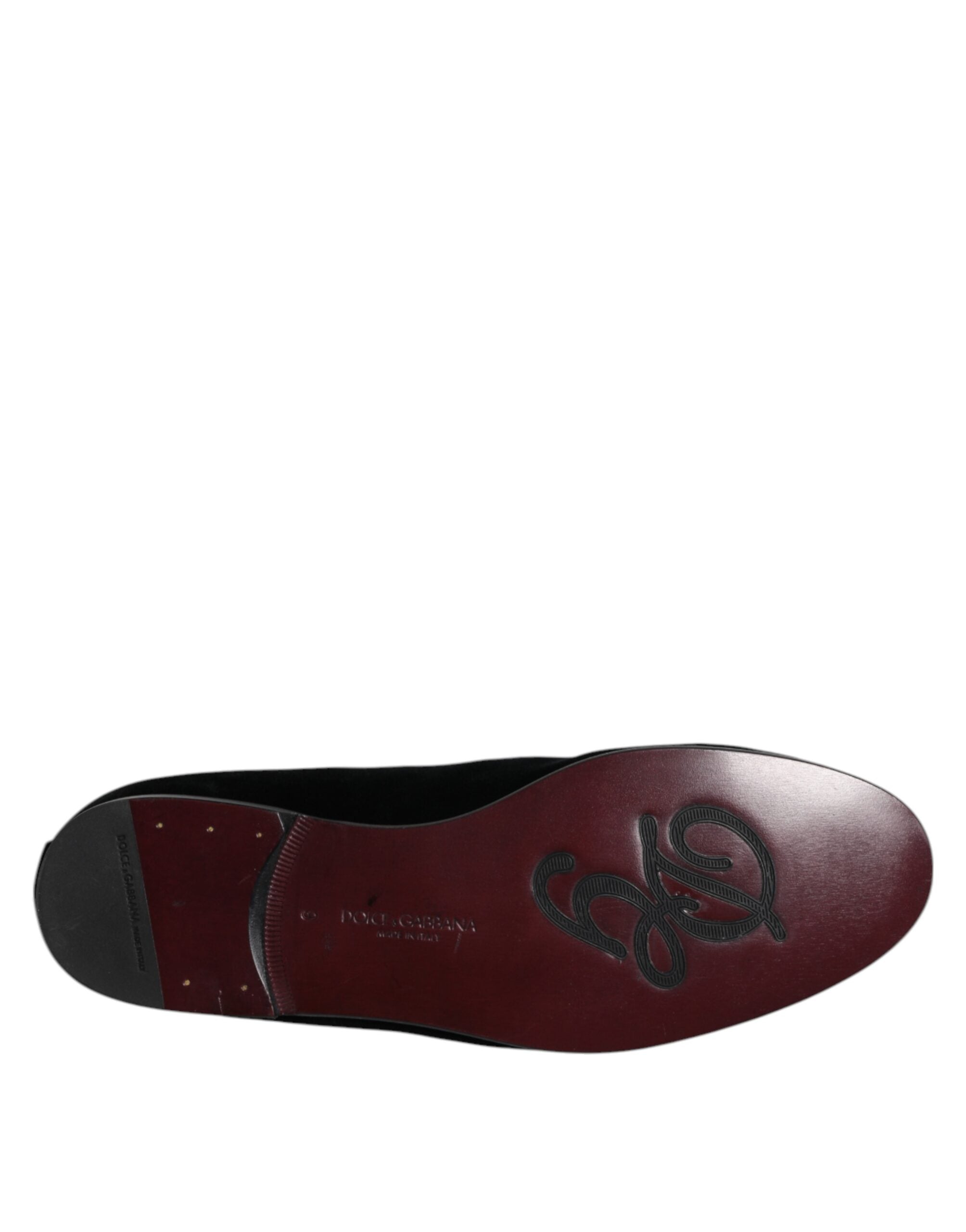 Step into a world of elegance with Dolce & Gabbana's Black Velvet Embellished Loafers, crafted in Italy from luxurious materials, embodying sophistication and allure.